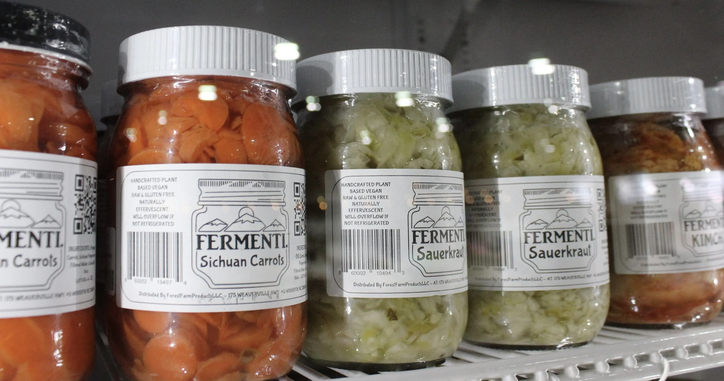 Jars of fermented vegetables, including Sichuan carrots and sauerkraut, at Burley Sustainable General Store in West Jefferson, NC.