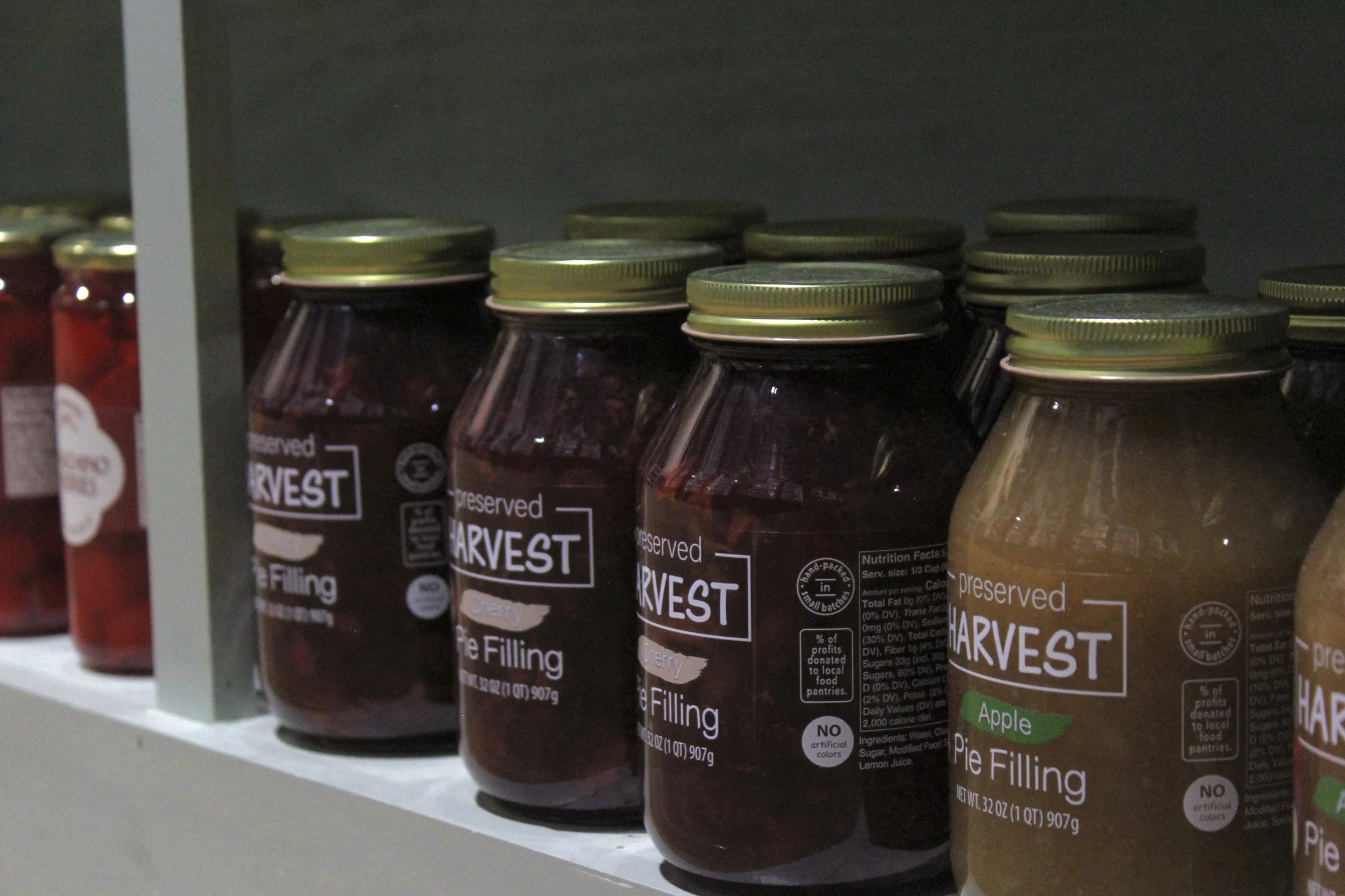 Jars of Harvest Pie Filling, including apple flavor, arranged at Burley Sustainable General Store in West Jefferson, NC.