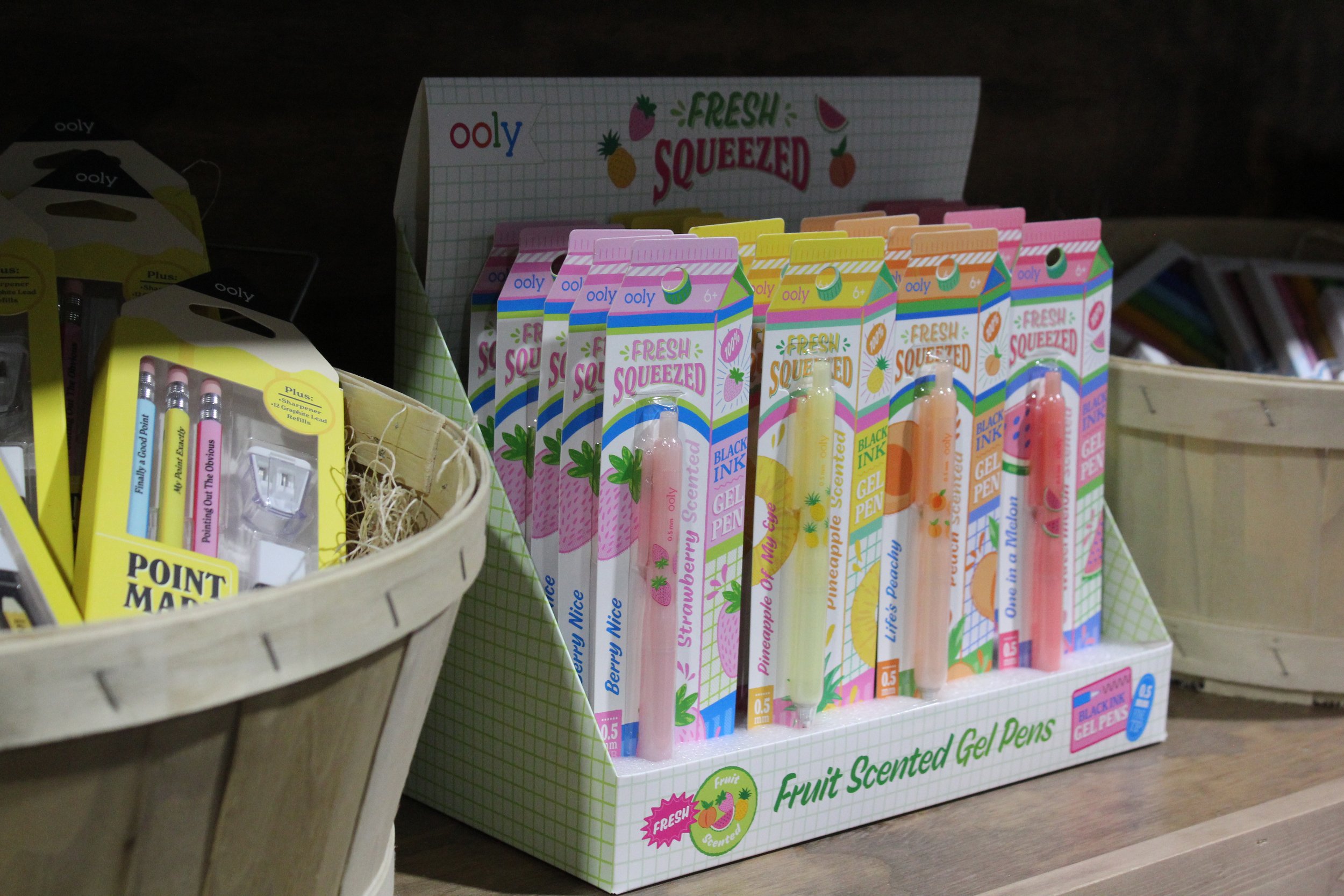 Display of fruit-scented gel pens in colorful packaging at Burley Sustainable General Store in West Jefferson, NC.