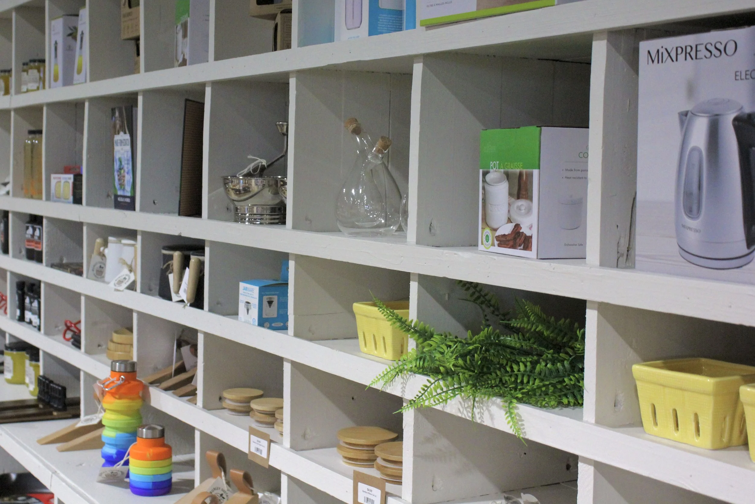  Various kitchen and household items including bowls, containers, glass bottles, at Burley Sustainable General Store in West Jefferson, NC.