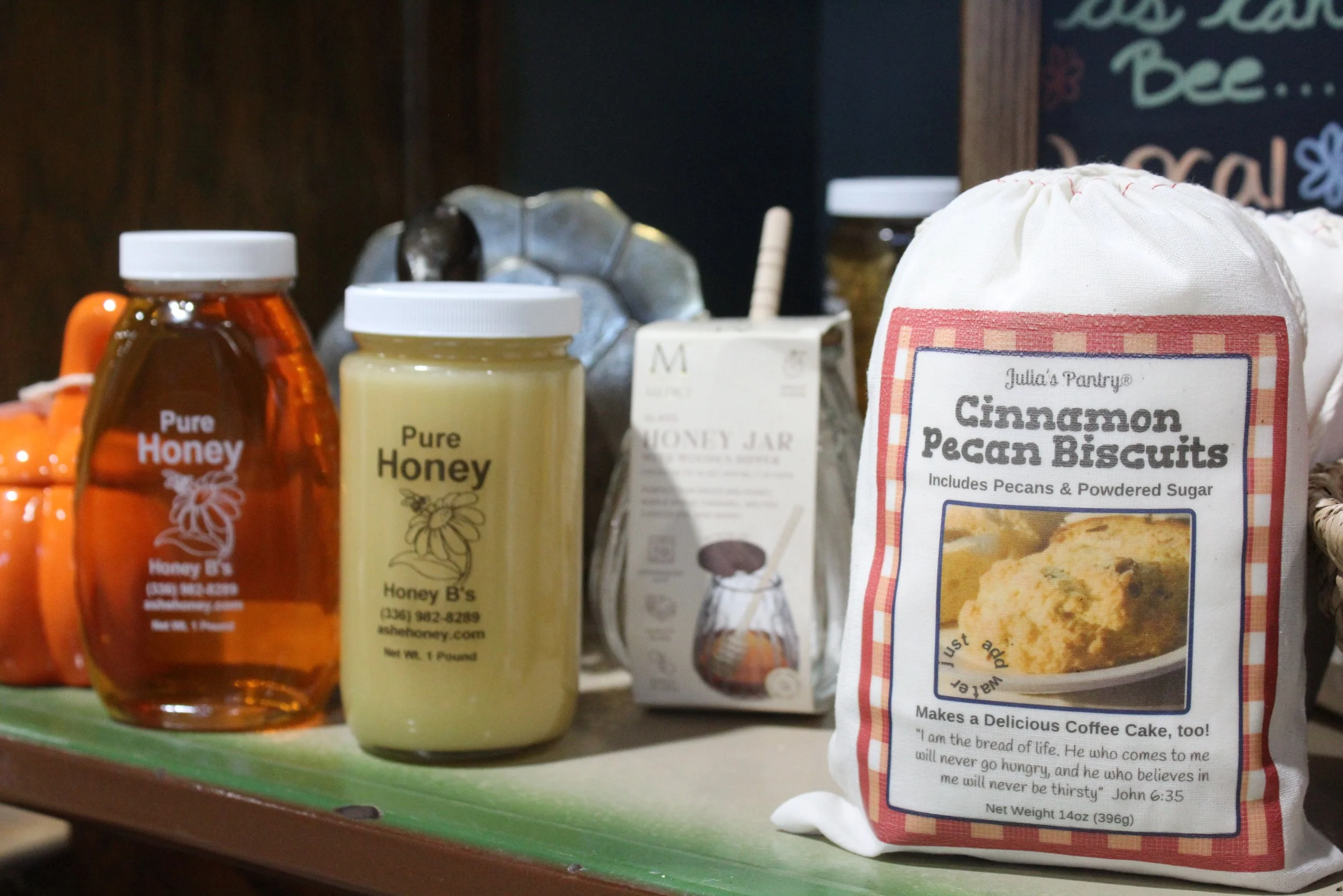 Jars of honey, a box of cinnamon pecan biscuits, and other baked goods at Burley Sustainable General Store in West Jefferson, NC.
