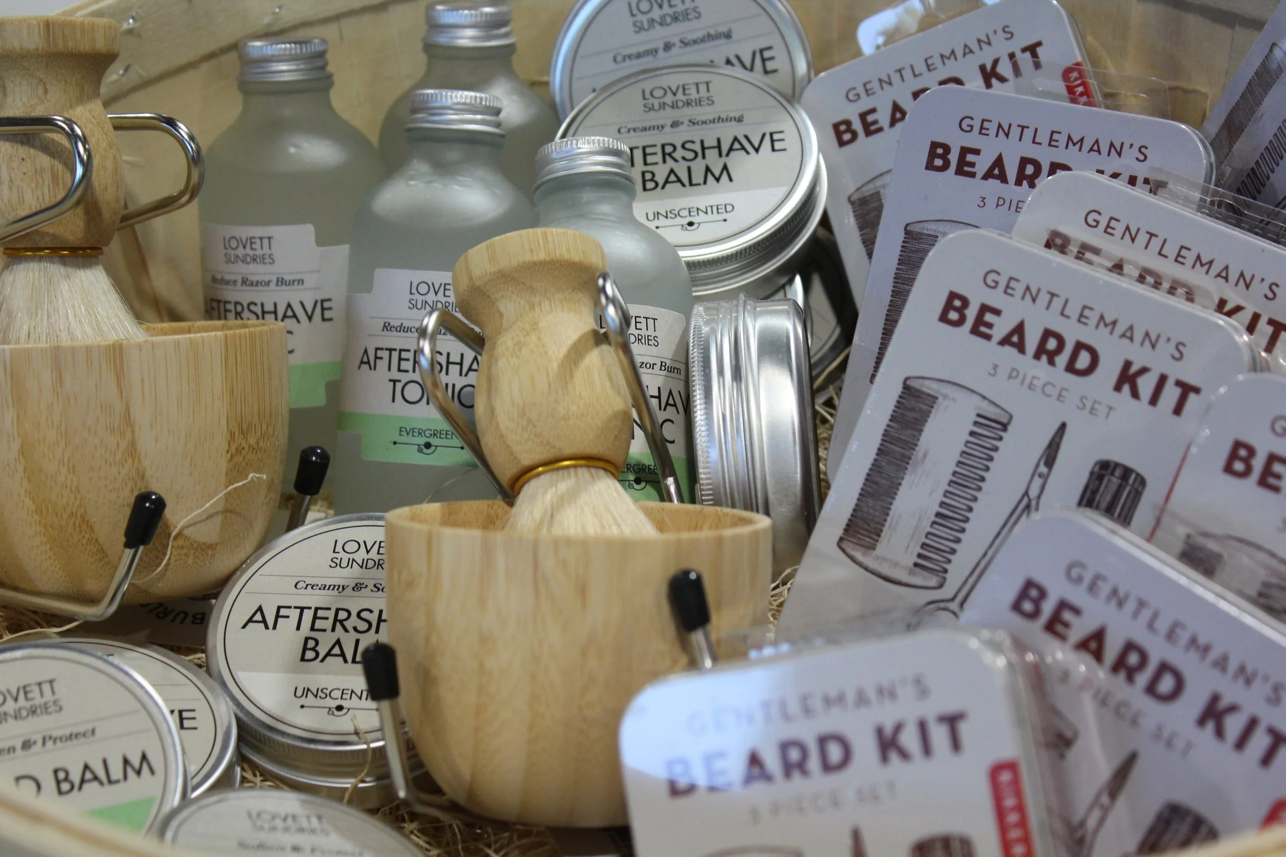 Assorted grooming products and gift sets, including aftershave balm, beard kit, and sundries at Burley Sustainable General Store in West Jefferson, NC.