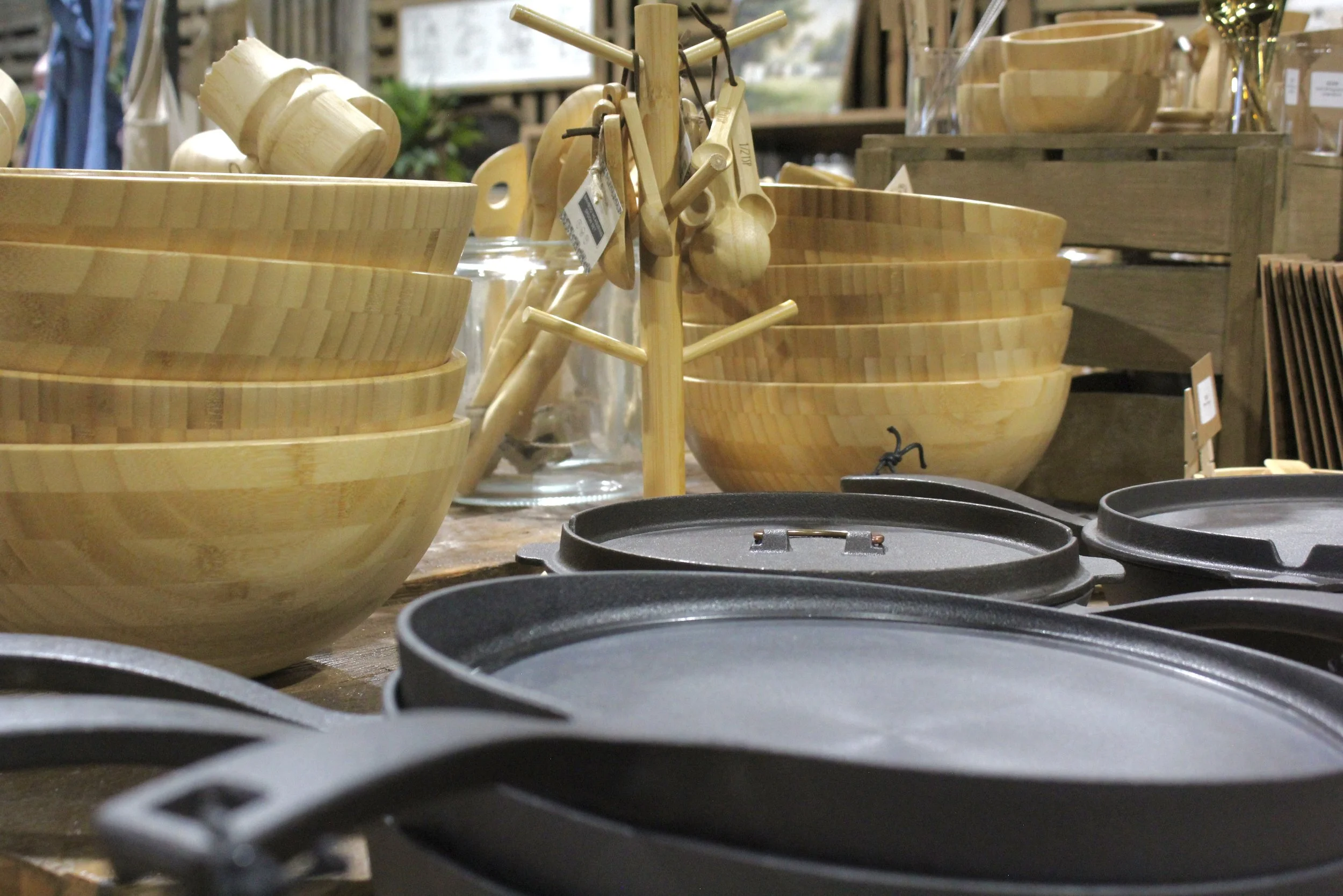 Sustainable wooden bowls and cast iron skillets in various sizes at Burley Sustainable General Store in West Jefferson, NC.