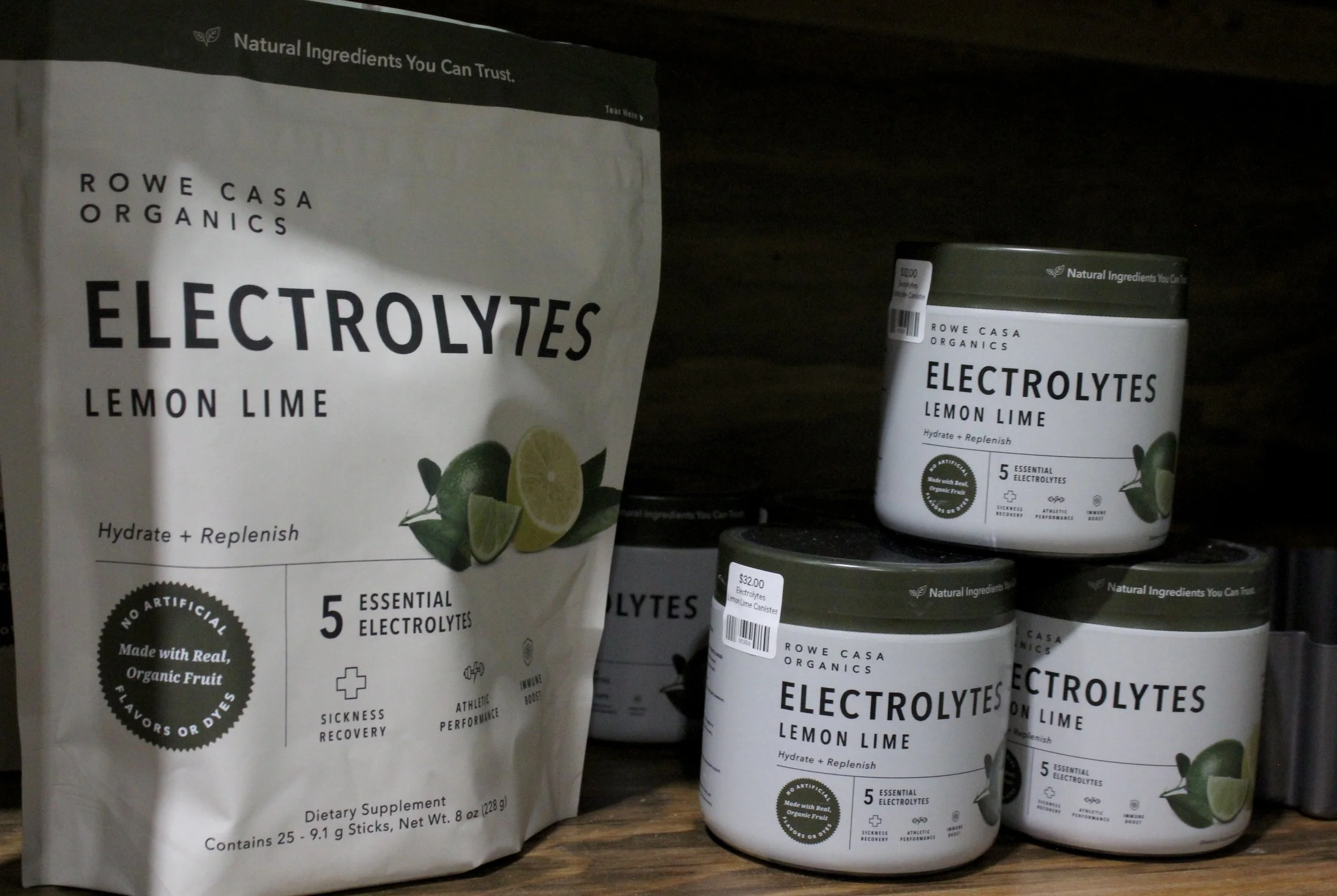 A bag of electrolytes powder and several small containers of electrolyte supplements 'Rowe Casa Organics Electrolytes Lemon Lime at Burley Sustainable General Store.