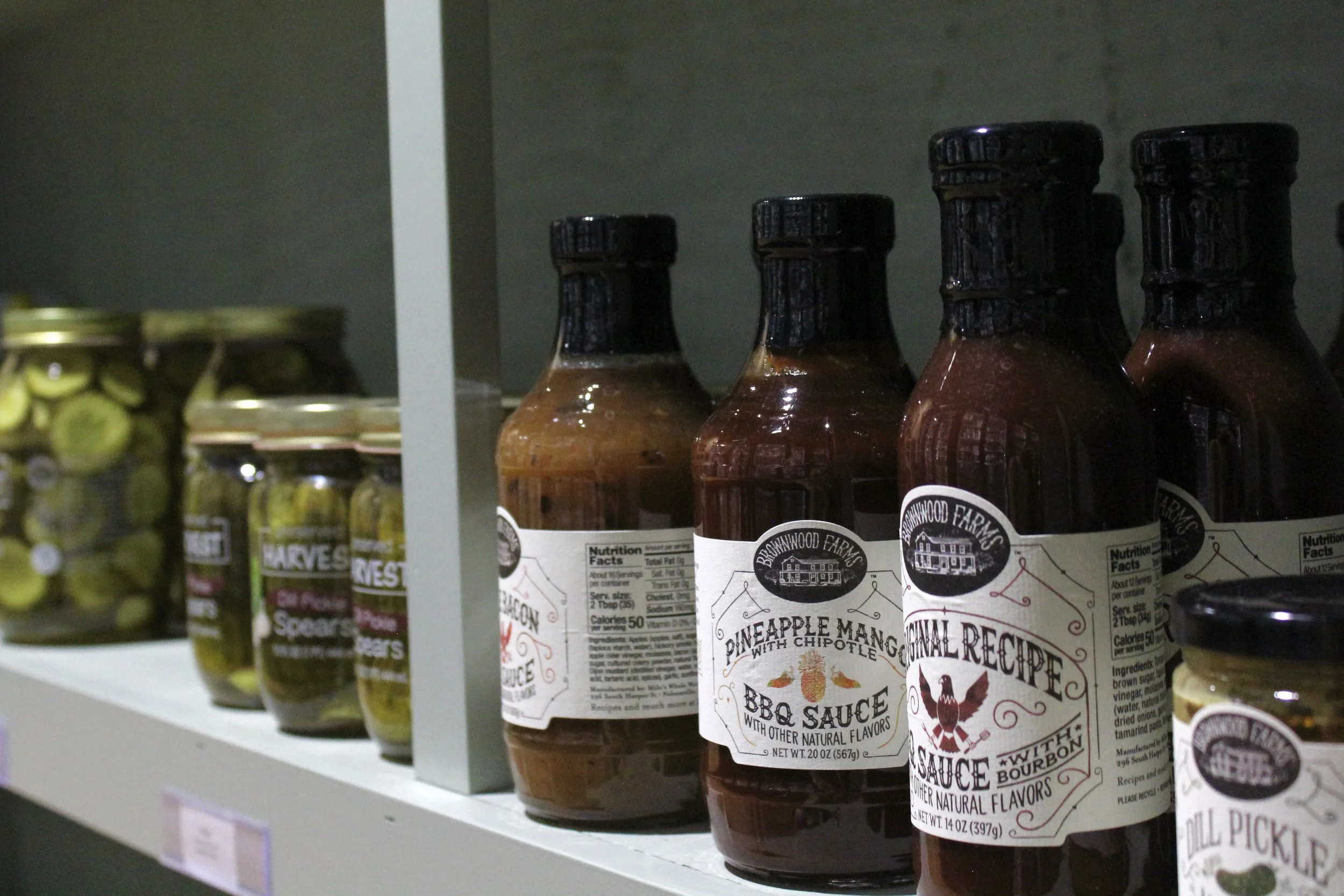 Large variety of sauces and canned goods at Burley Sustainable General Store in West Jefferson, NC.