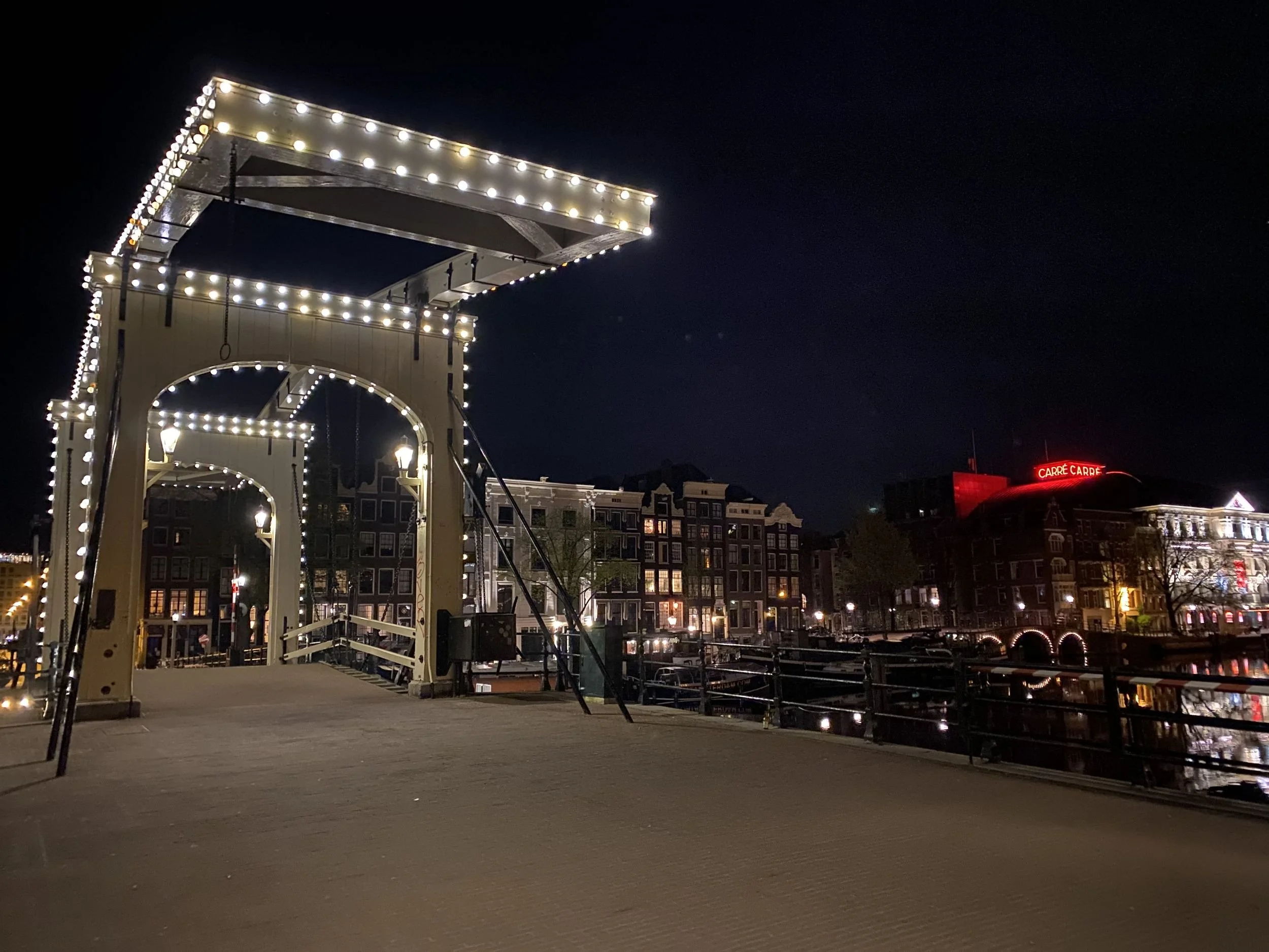 The Magere Brug lit up at night over the Amstel in Amsterdam