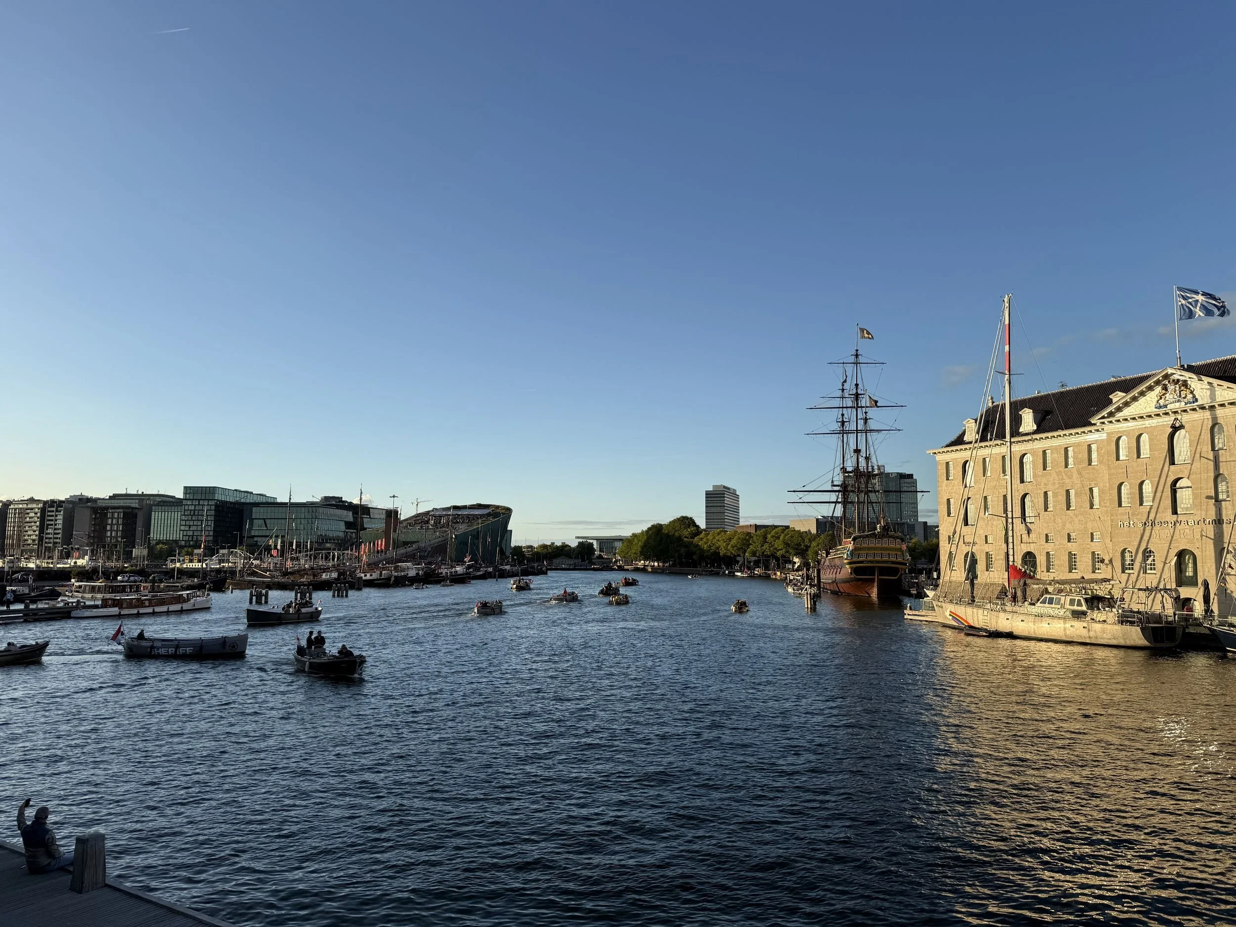 Tall ship and the Maritime Museum on the IJ harbor in Amsterdam
