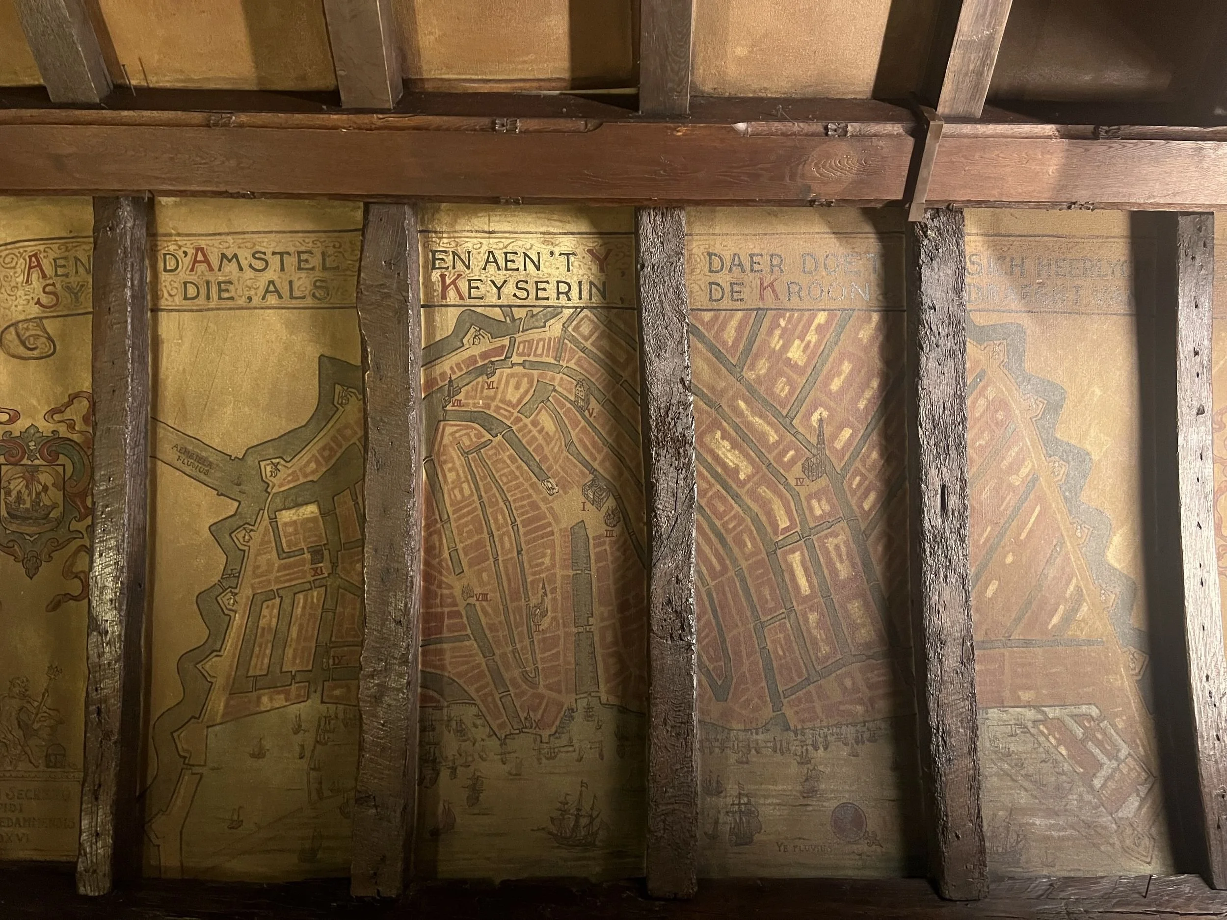 Old map of Amsterdam painted on wooden ceiling beams