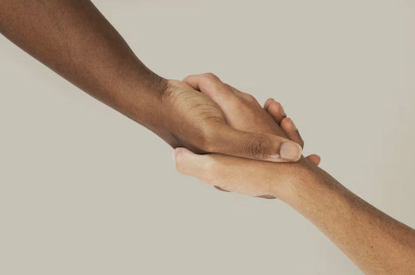 Trust and support in one-on-one communication coaching, symbolised by a handshake