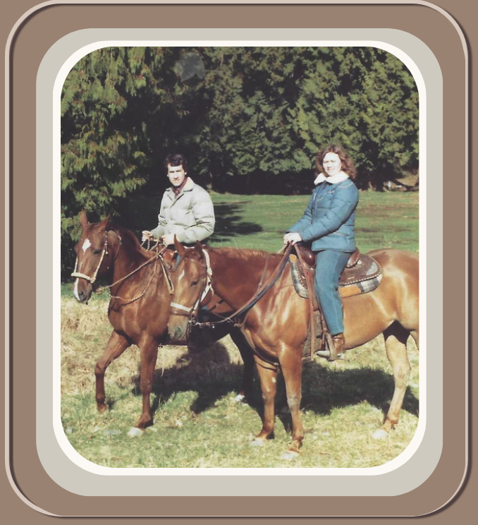 Linda Anne Star and husband Kenn riding horses outdoors on grass with trees in the background. Linda Anne Starr | Training the Horse's Beautiful Mind