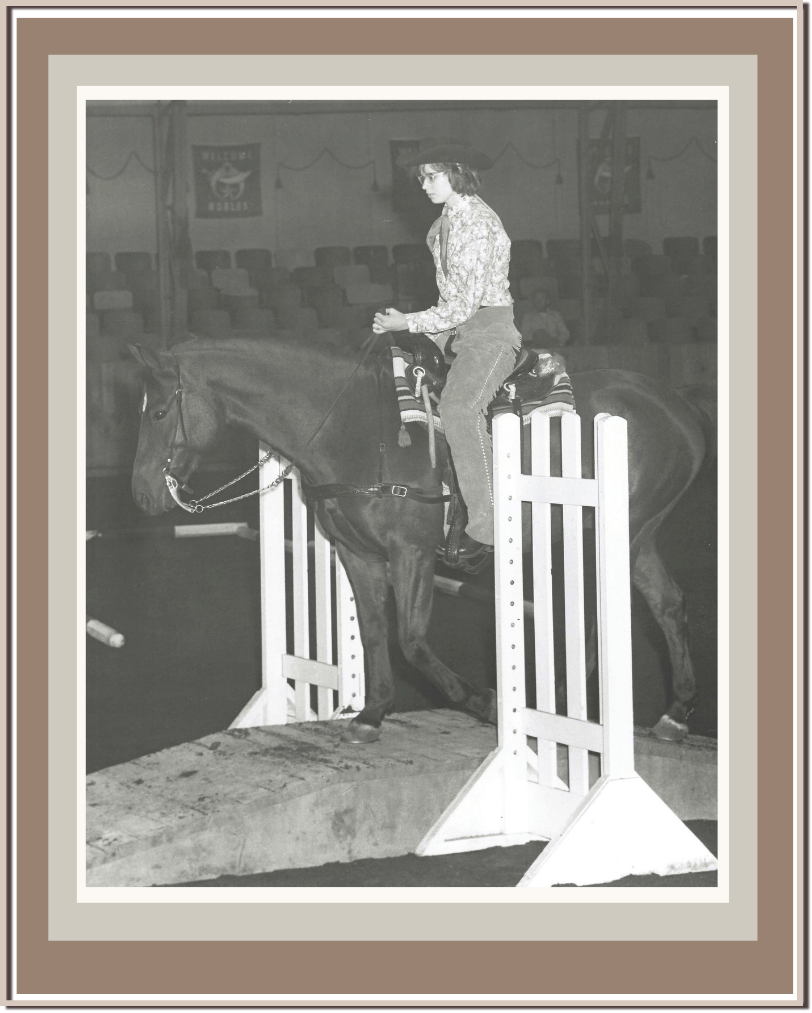 Linda Anne Starr riding a horse at an equestrian event. Linda Anne Starr | Training the Horse's Beautiful Mind