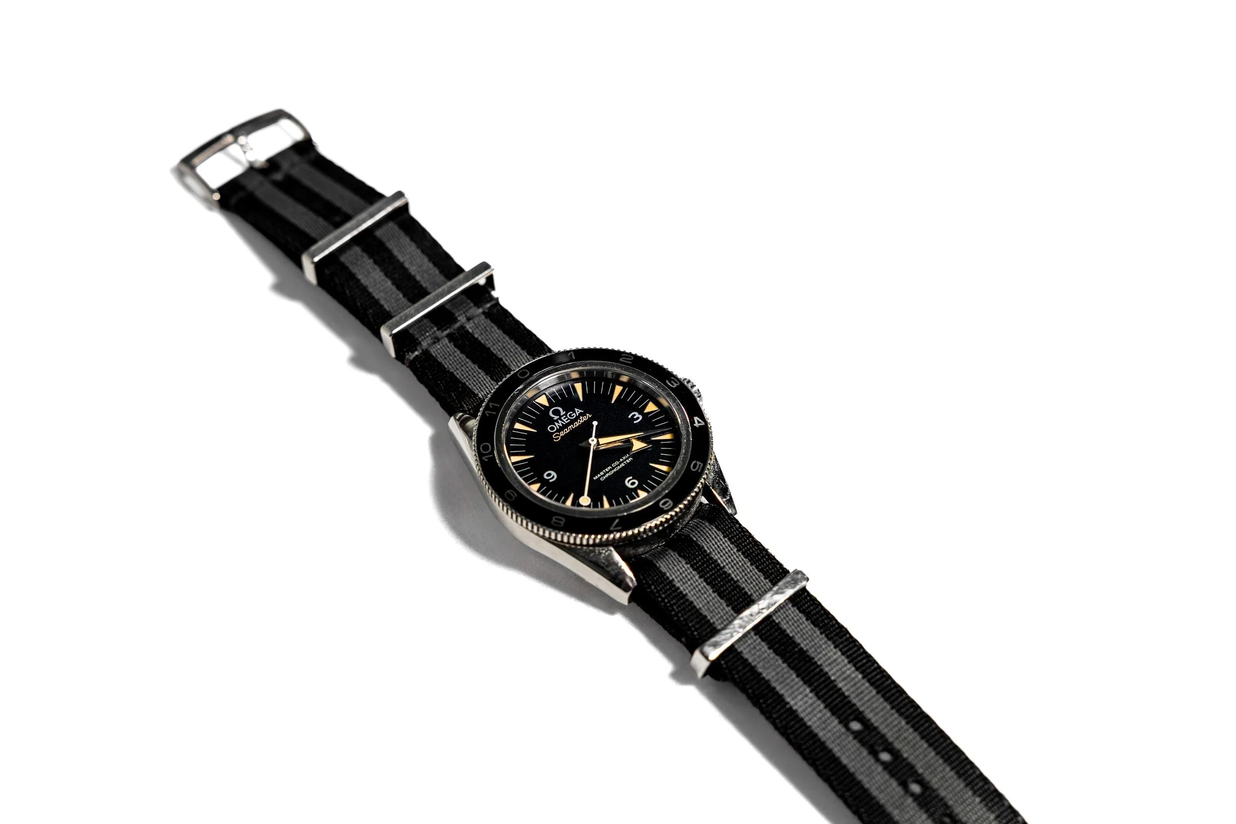 Omega Seamaster wristwatch with black dial and NATO strap