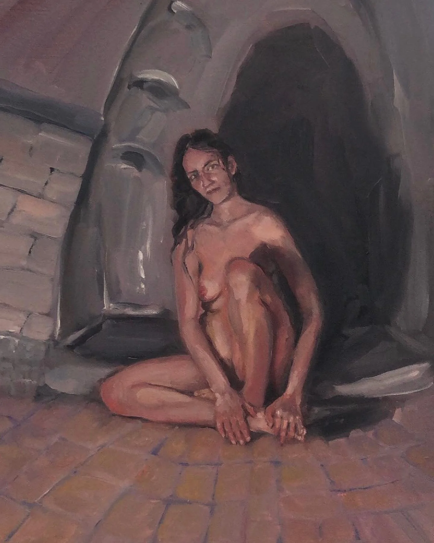 A painting of a nude woman sitting on the floor with her legs crossed and her hands resting on her knees, against a dark background with a stone fireplace on the left side.