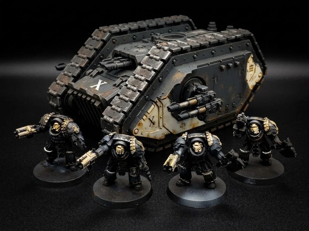 Miniature models of futuristic soldiers and a tank with a black background.