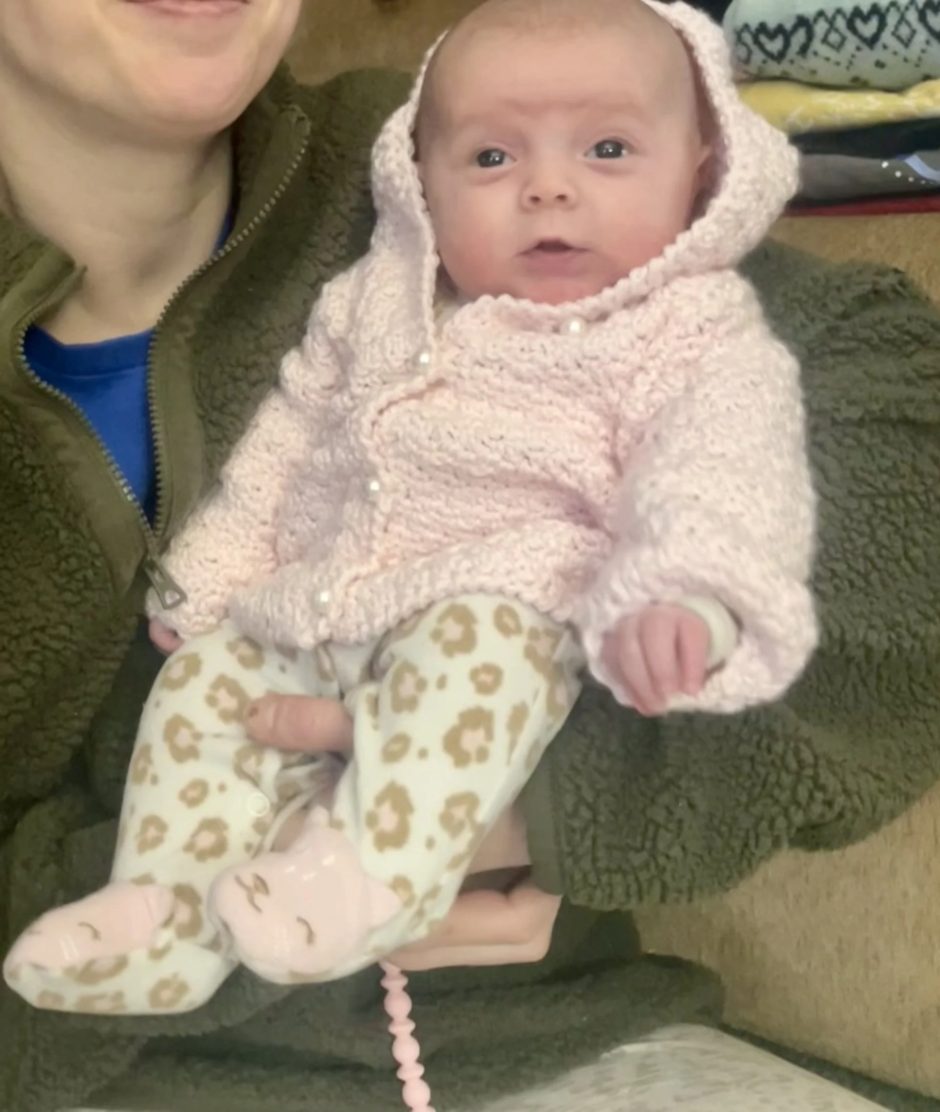 A baby girl wearing the Daydream sweater created by Tessa Smith Designs.