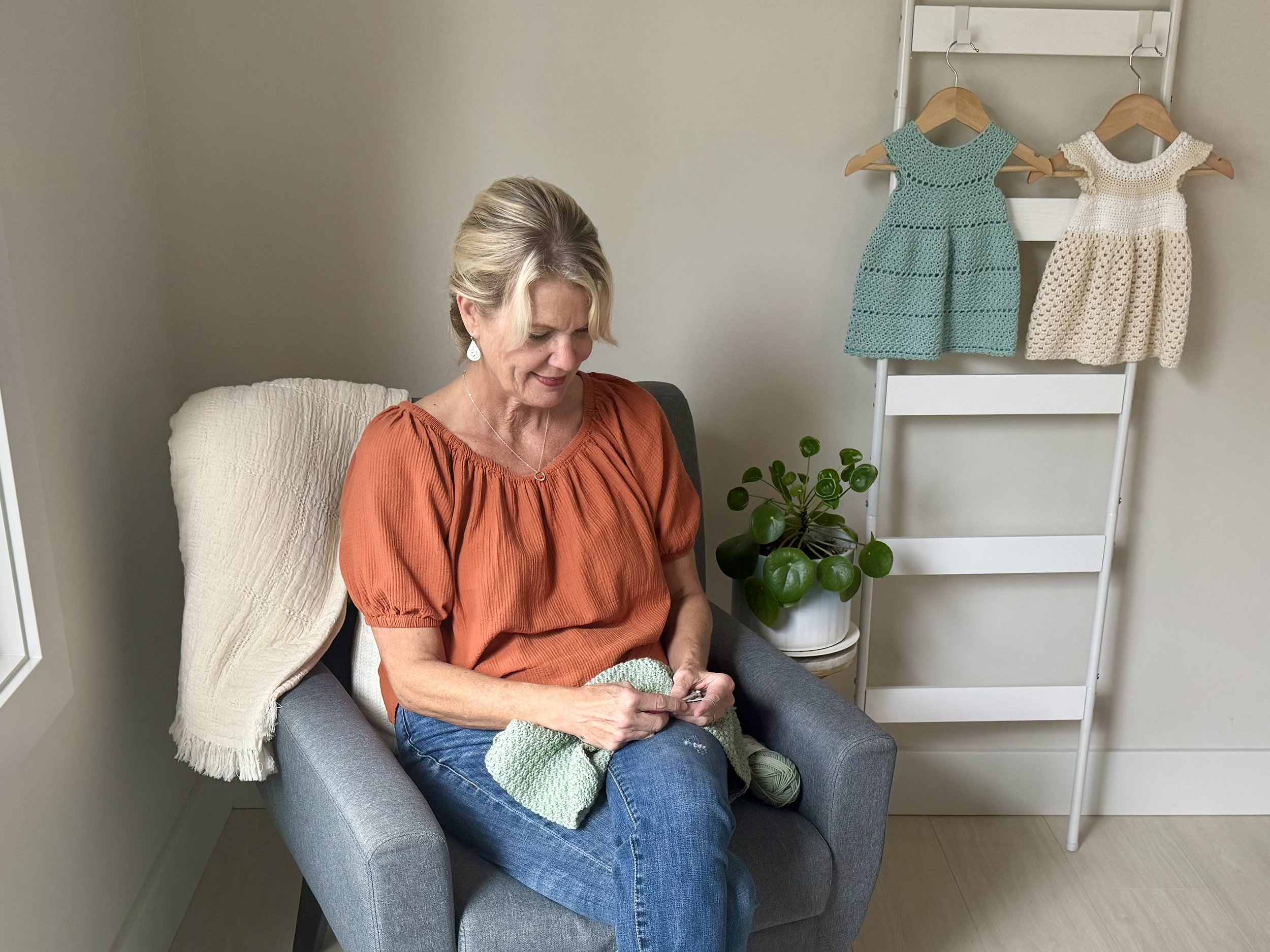 Tessa Smith crocheting her most recent cardigan pattern design.