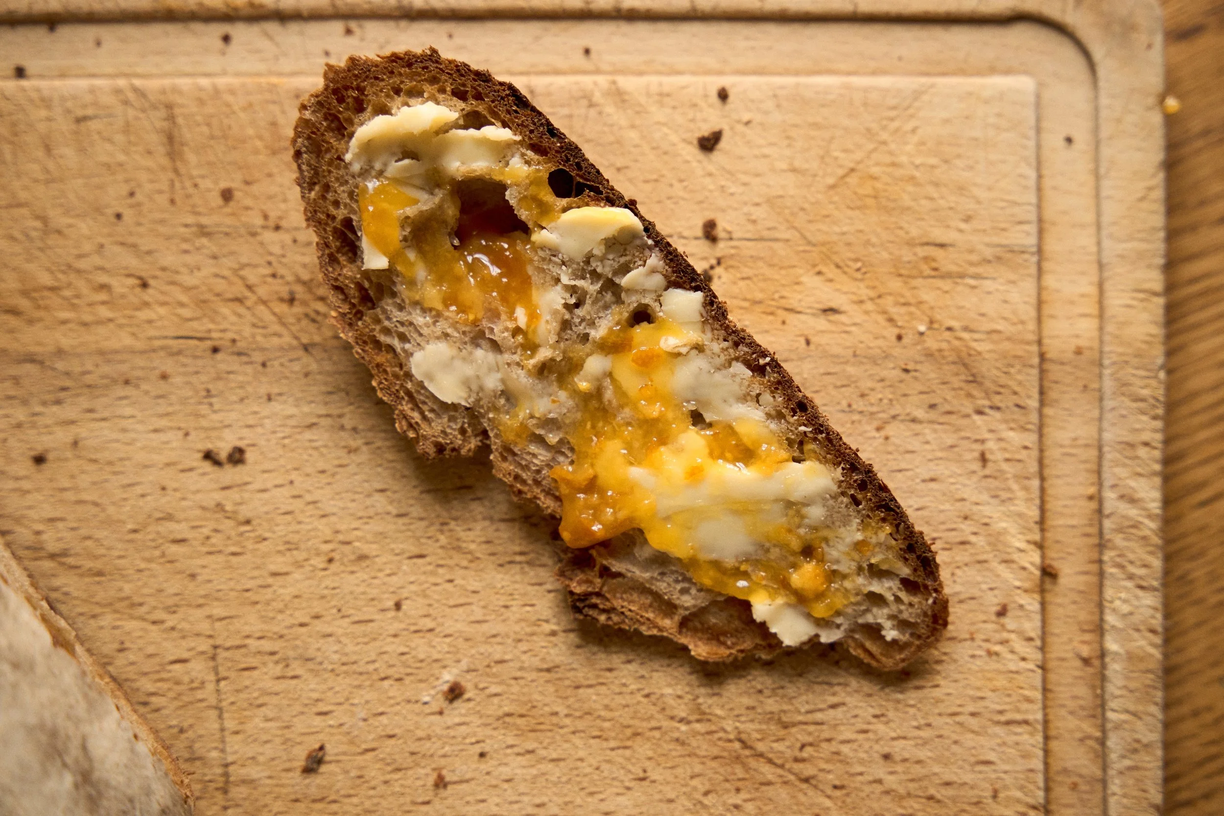 French jam spread on a slice of rustic bread