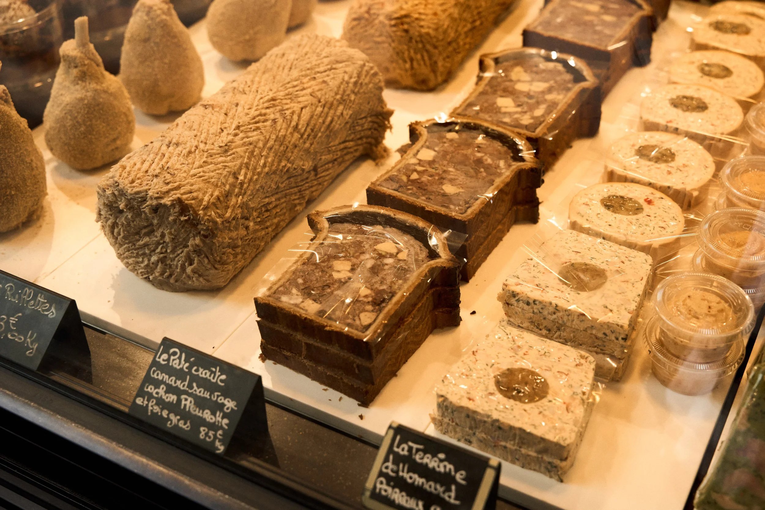 Pâté en croûte and terrines displayed at Arnaud Nicolas in Paris