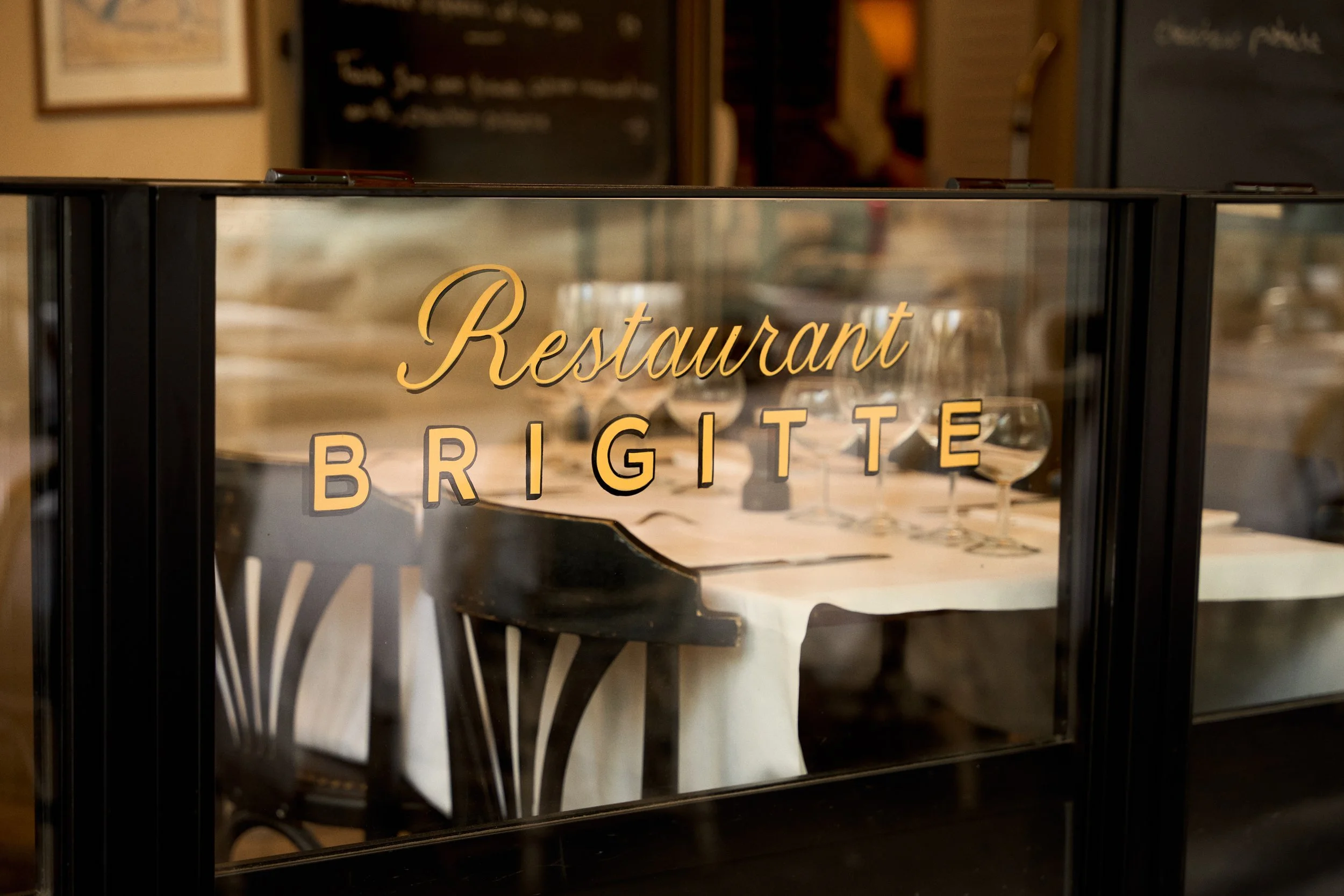 Brigitte restaurant sign and dining room in Paris
