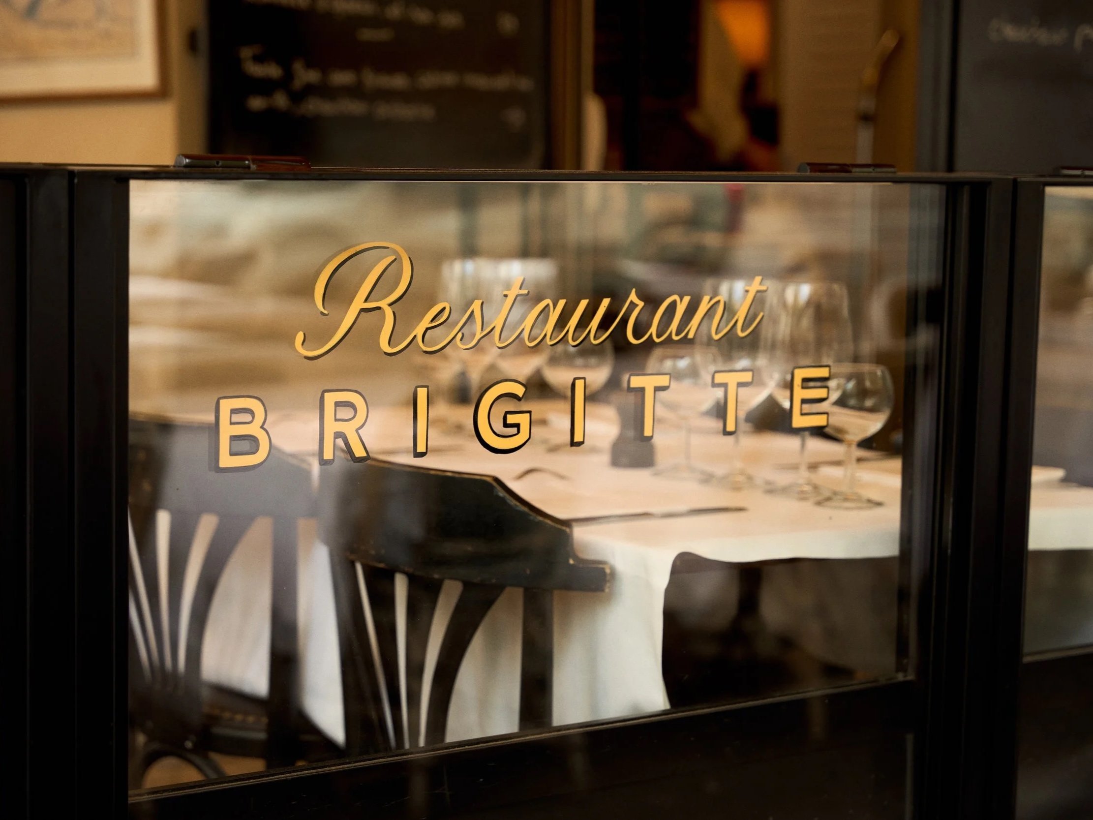Brigitte restaurant sign and dining room in Paris