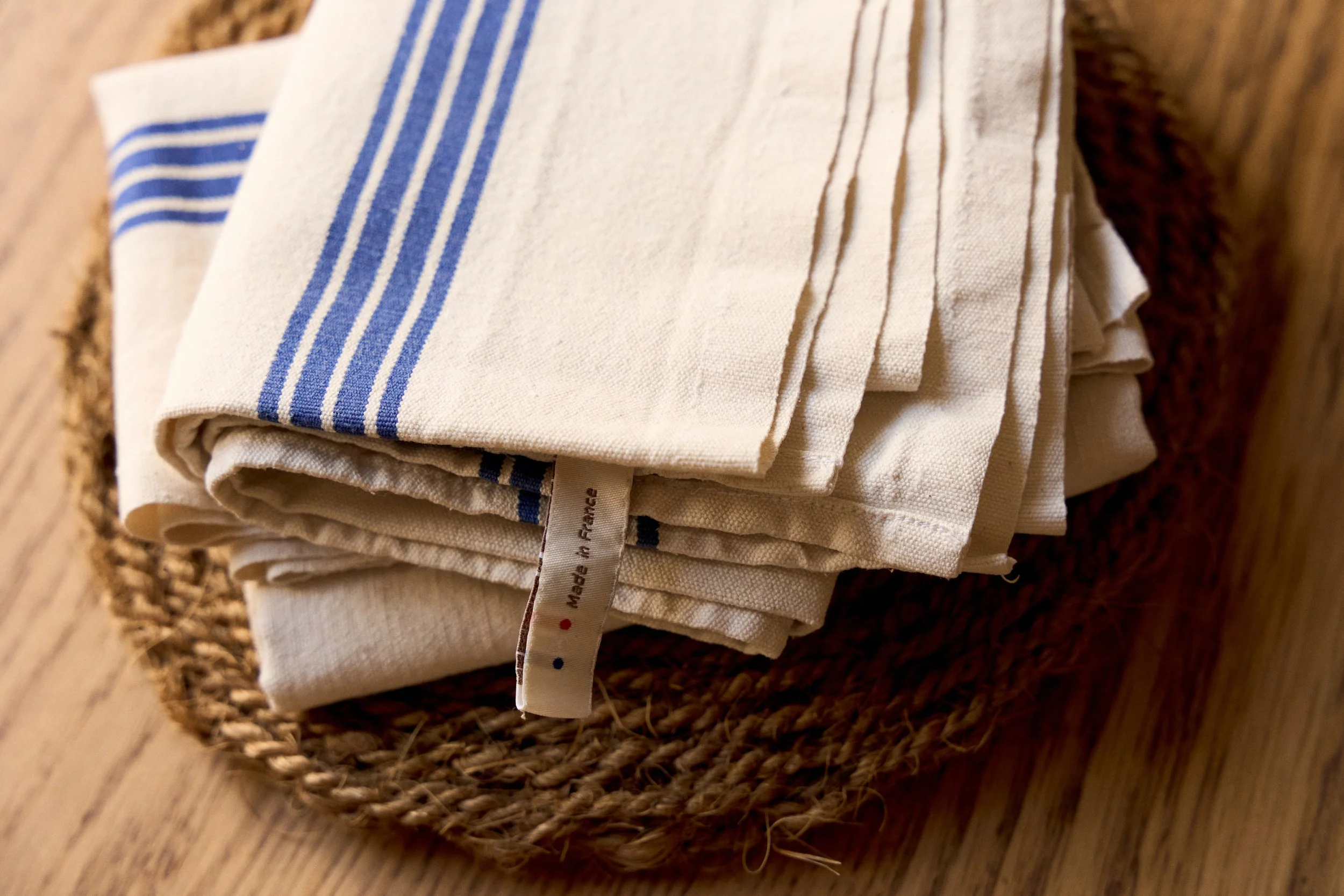 Stack of blue-striped French linen kitchen towels