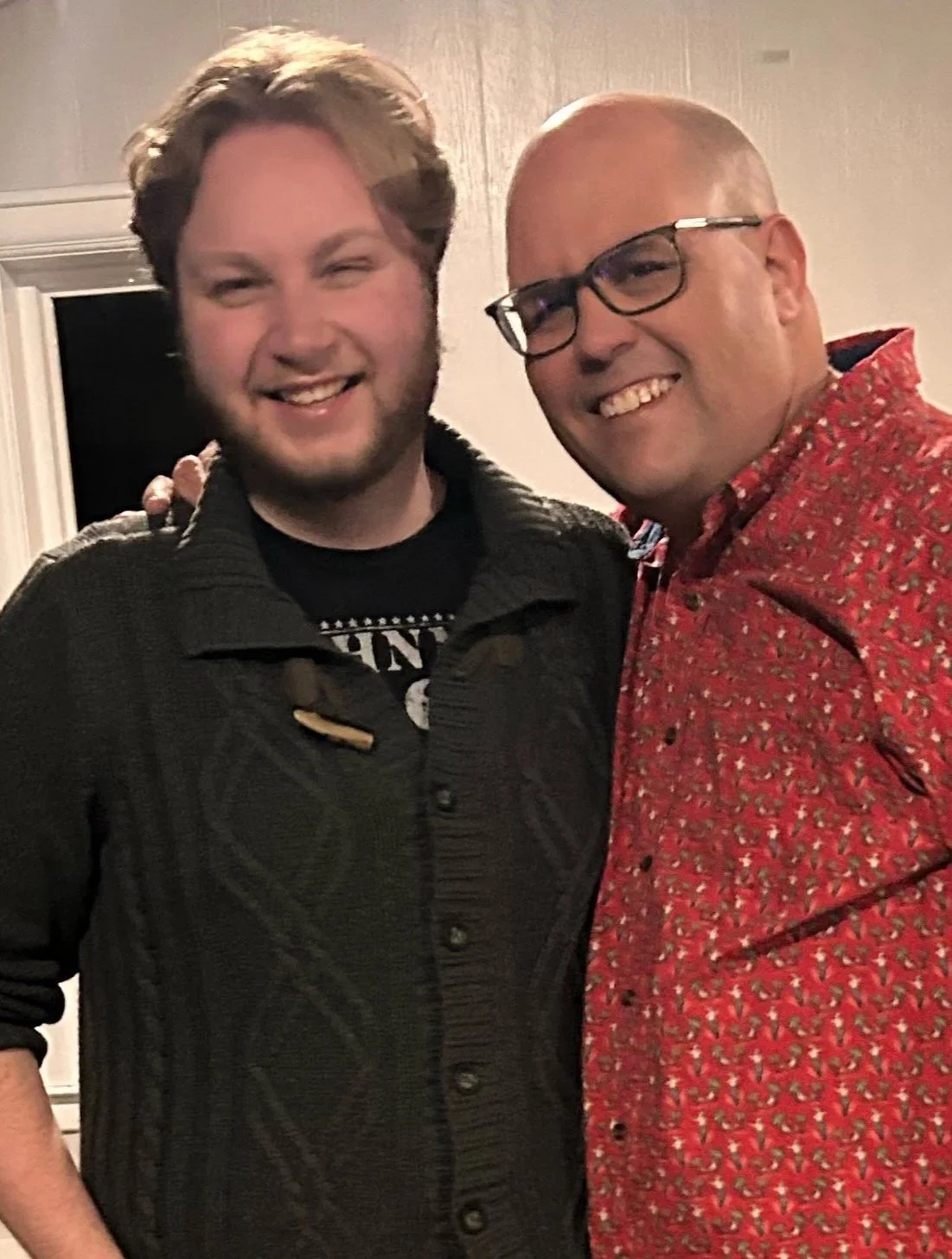 Two men smiling together at Refuge