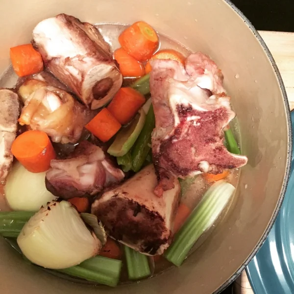 Bone broth is made with bones and cuts of meat high in COLLAGEN; such as marrow, knuckles, and feet. You can use bones from so many types of animals; lamb, pork, chicken, veal… you name it.