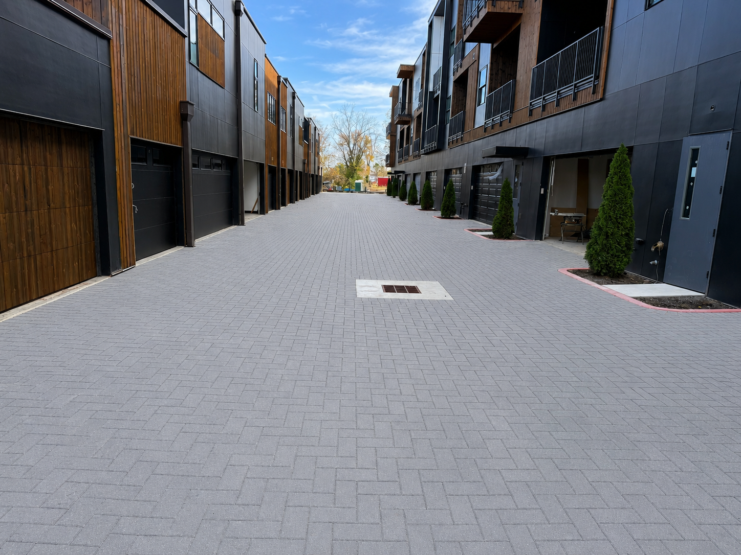 Paved driveway and walkway between townhome buildings at The Haven in Bentonville, installed by 4G Paving