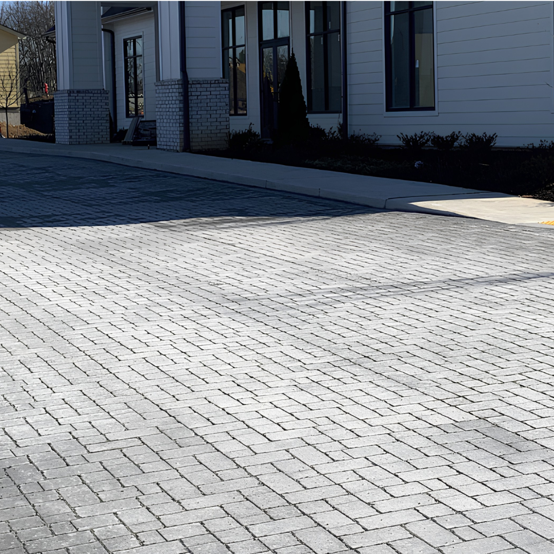 Paver driveway installation in front of a home by 4G Paving in Springdale, Arkansas