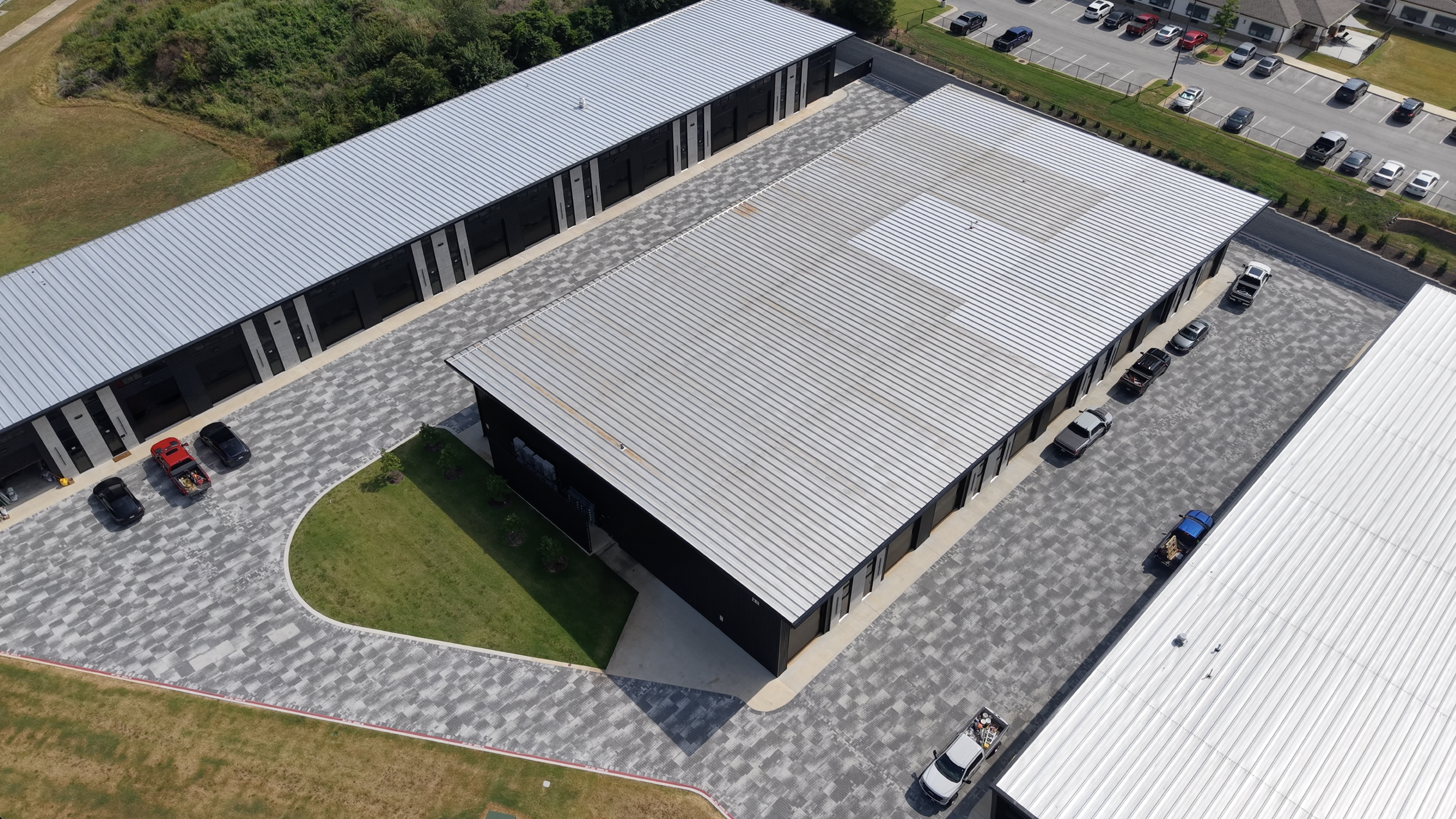 Aerial view of parking and drive-aisle paving completed by 4G Paving at Marque Collection Suites