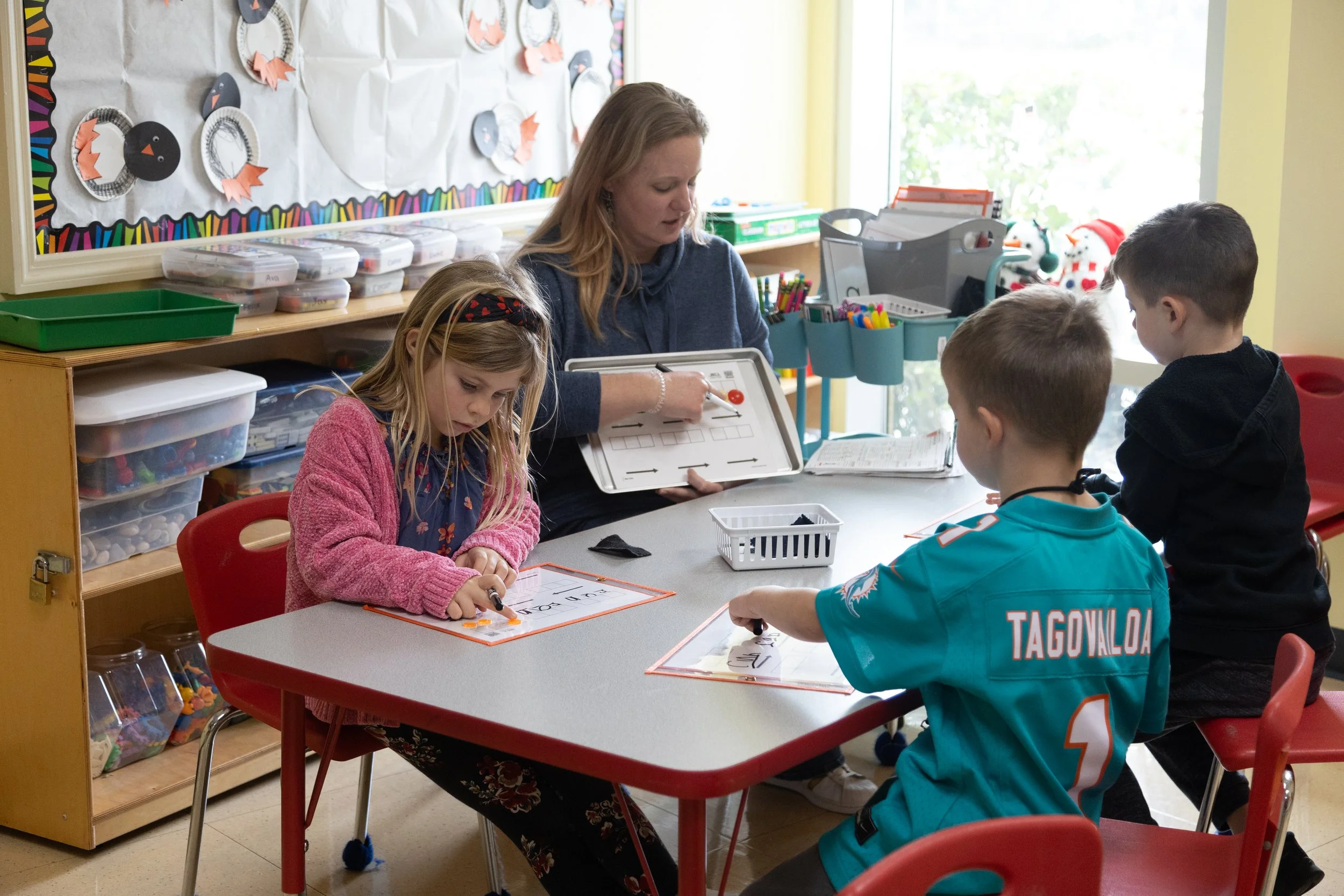 Kindergarten teacher leading a small-group lesson at Cooperative School at Northland in Longwood, FL