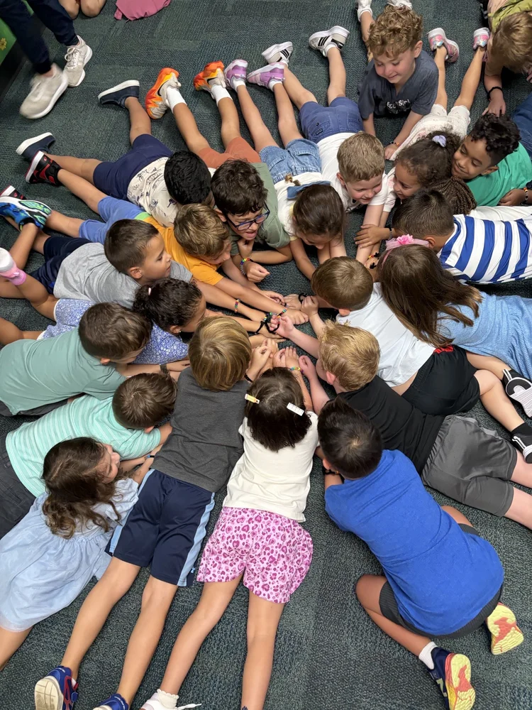 Cooperative School at Northland students gathered in a circle