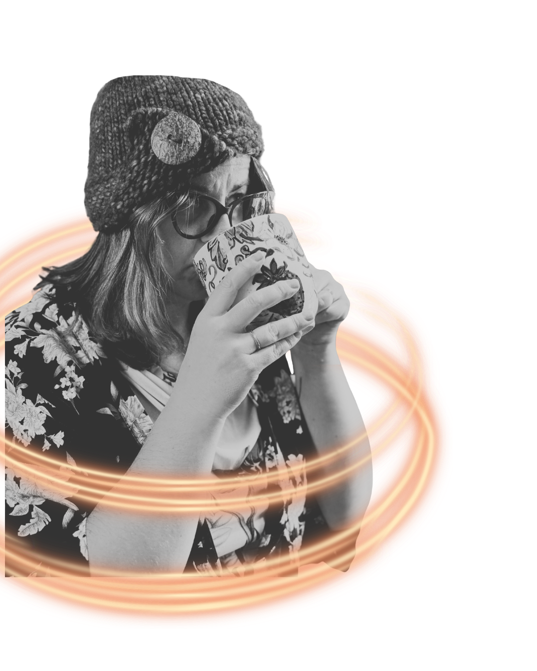 Black and white photo of a woman wearing a knit hat with a button, glasses, and a floral dress, holding a decorative cup close to her lips, with orange swirling light effects around her.