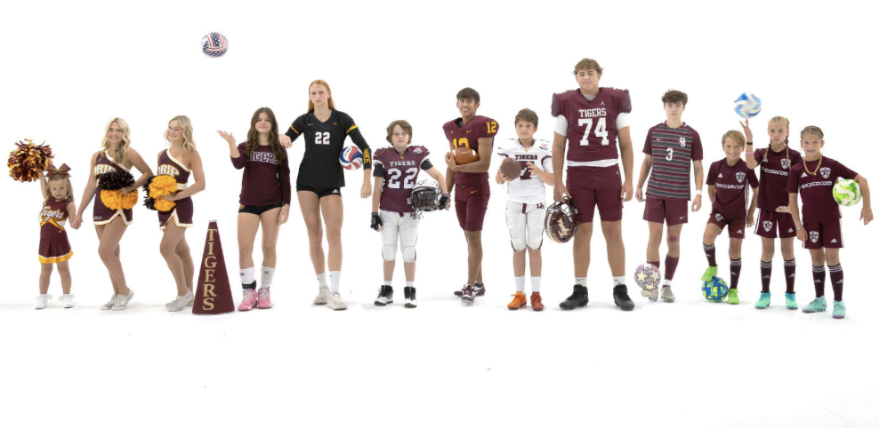 Group of children and teenagers dressed in cheerleading and football uniforms, holding sports equipment and pom-poms, standing on a white background.