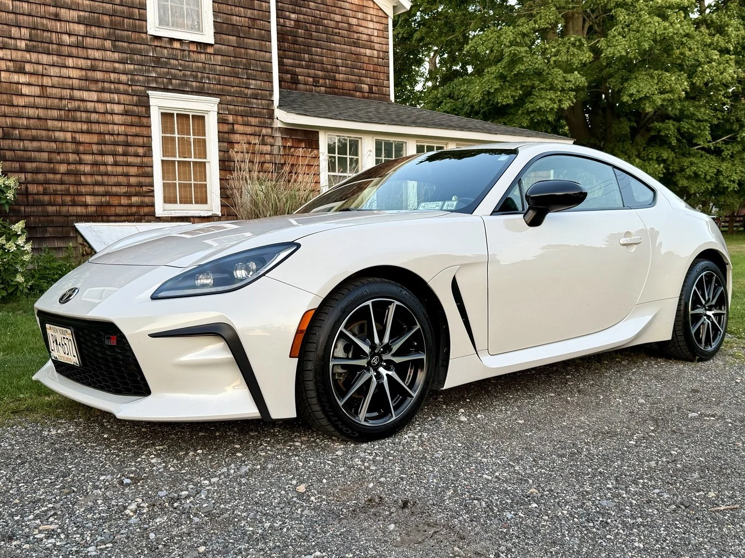 White Toyota GR86 photographed after exterior refinement.