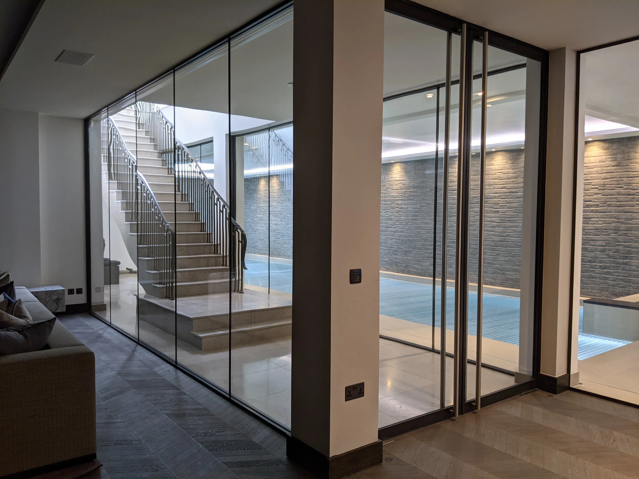 Modern interior building with a staircase and glass walls.
