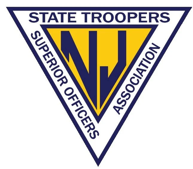 Logo of the State Troopers Superior Officers Association featuring a large yellow and blue shield with a stylized 'V' and 'J' in the center.