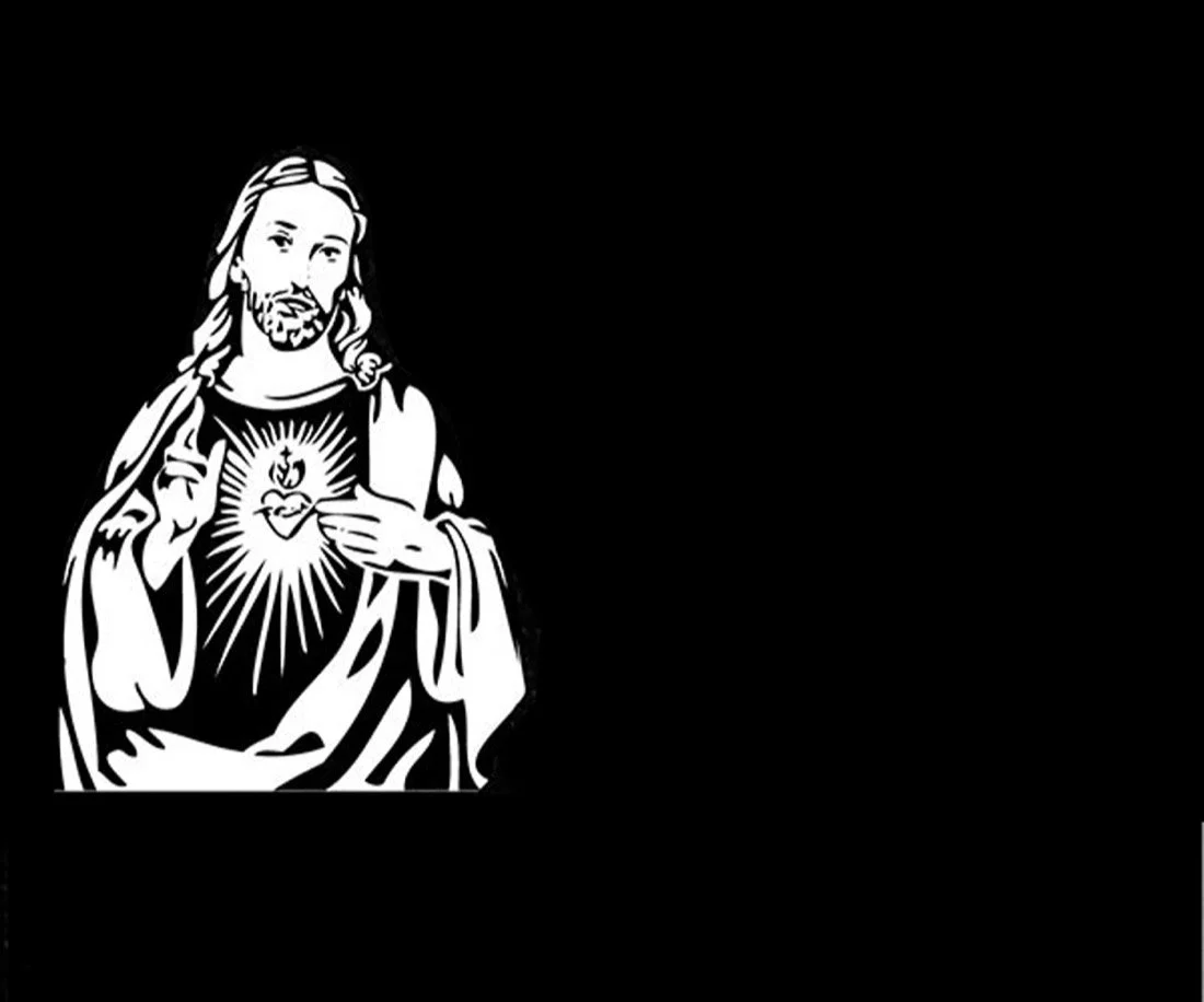 Lápida en granito negro  grabada mediante la técnica de chorro de arena imagen de Corazón de Jesús. Obra artesanal realizada con precisión por el escultor Raúl Abad en nuestro taller de Alfara del Patriarca (Valencia).