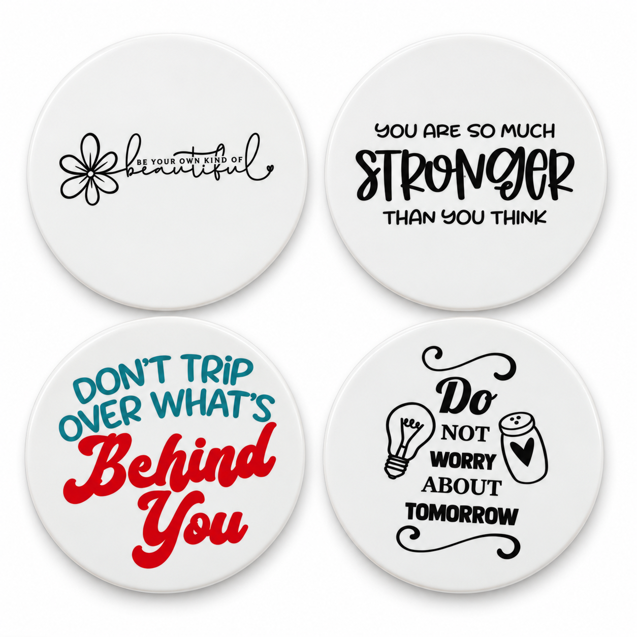 Four white ceramic coasters with inspirational quotes.png