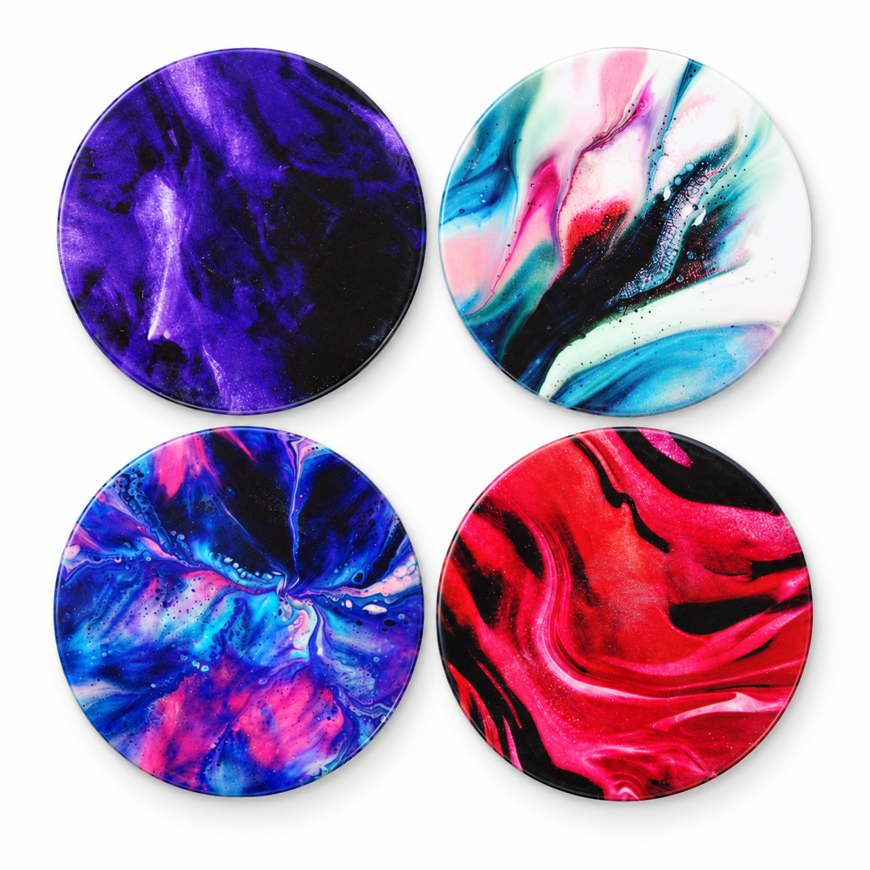 Four unique fluid art ceramic coasters.png