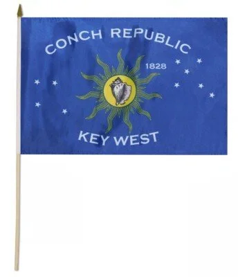 Flag of Conch Republic, Key West, with blue background and emblem featuring a conch shell and compass rose.