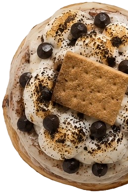 A dessert topped with whipped cream, chocolate chips, and a large cookie on top.