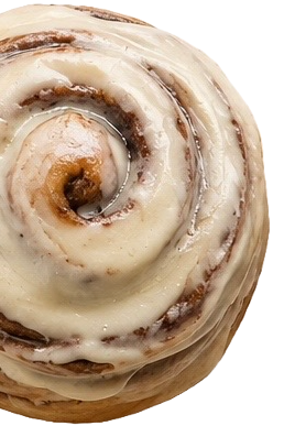 Close-up of a cinnamon roll with icing.