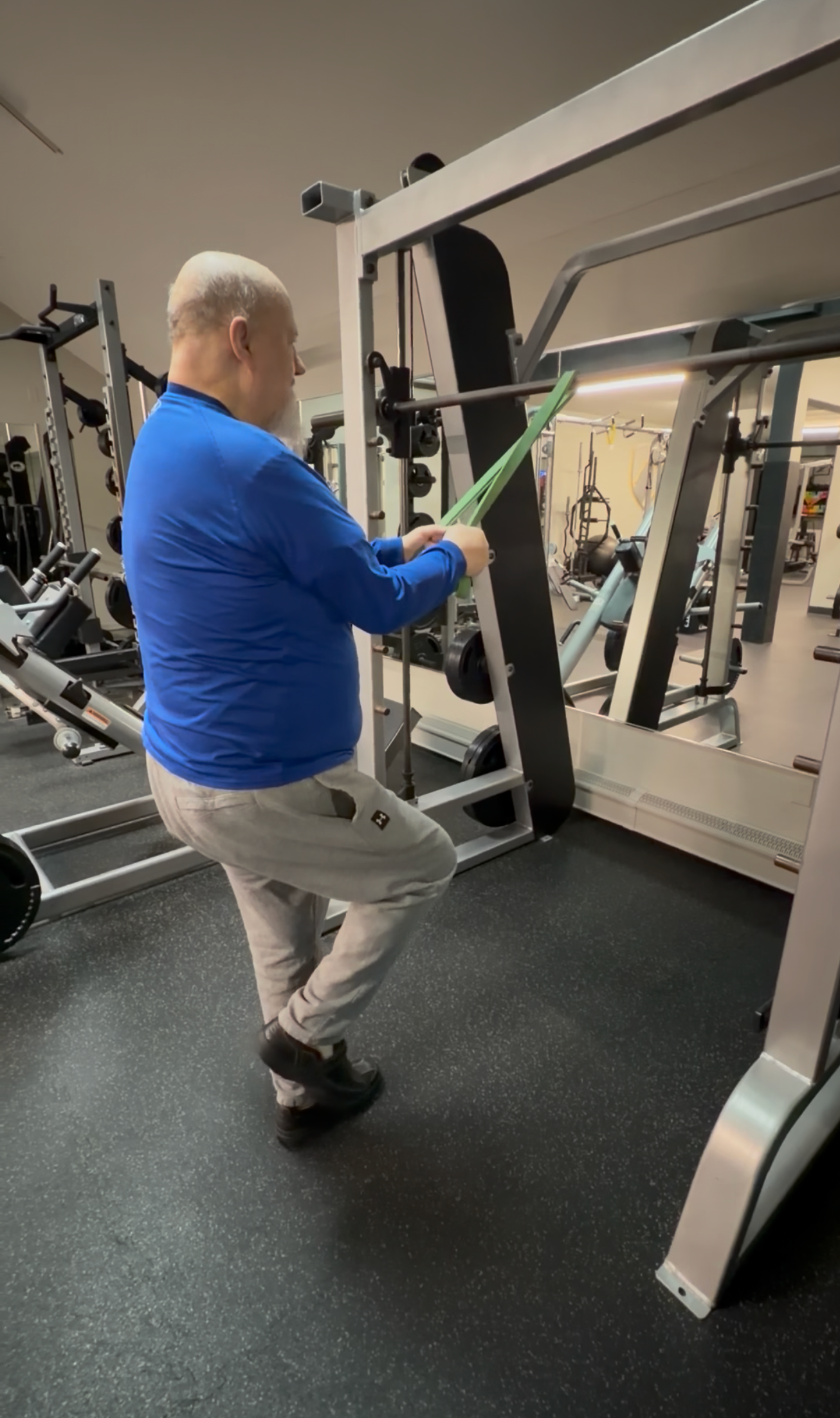 An older client working on balance and maintaining muscle.