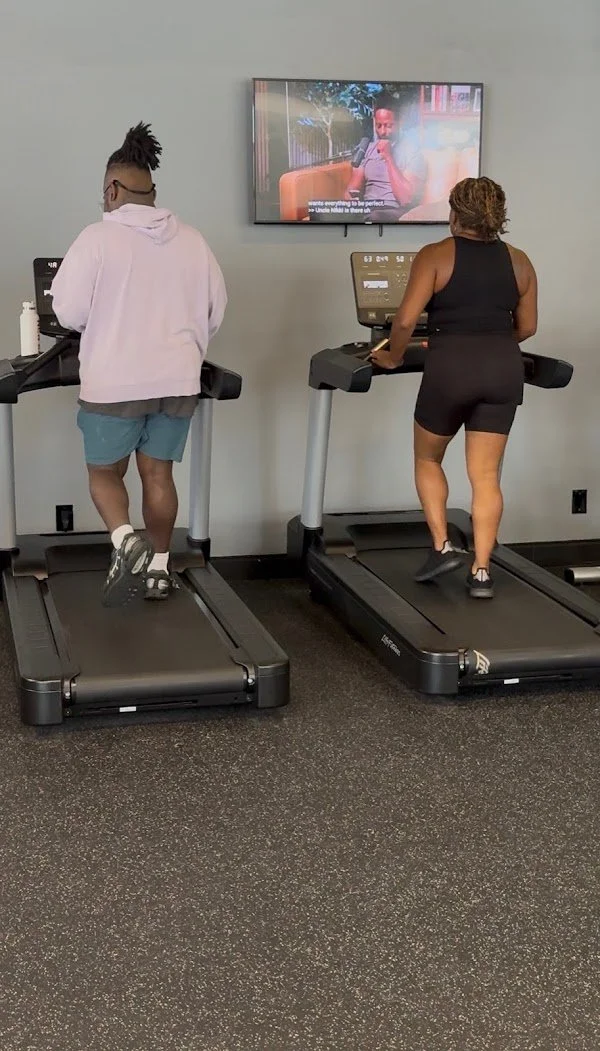Clients walking on the treadmill after their session to help reach their weight loss goals.