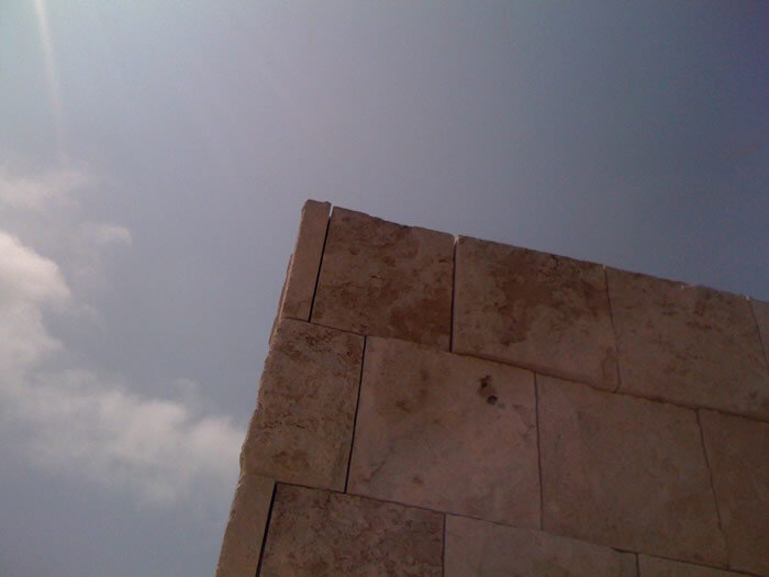 Travertine squares- gaps between the stone allow for earthquake movement.