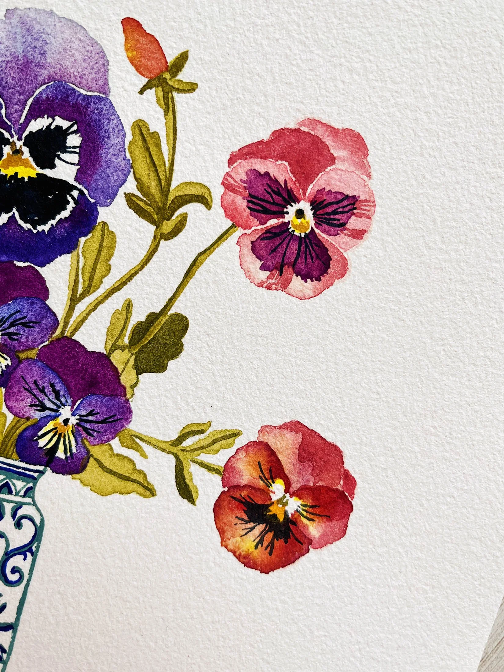 Watercolor painting of assorted colorful flowers, including purple, red, and orange blossoms with green leaves.