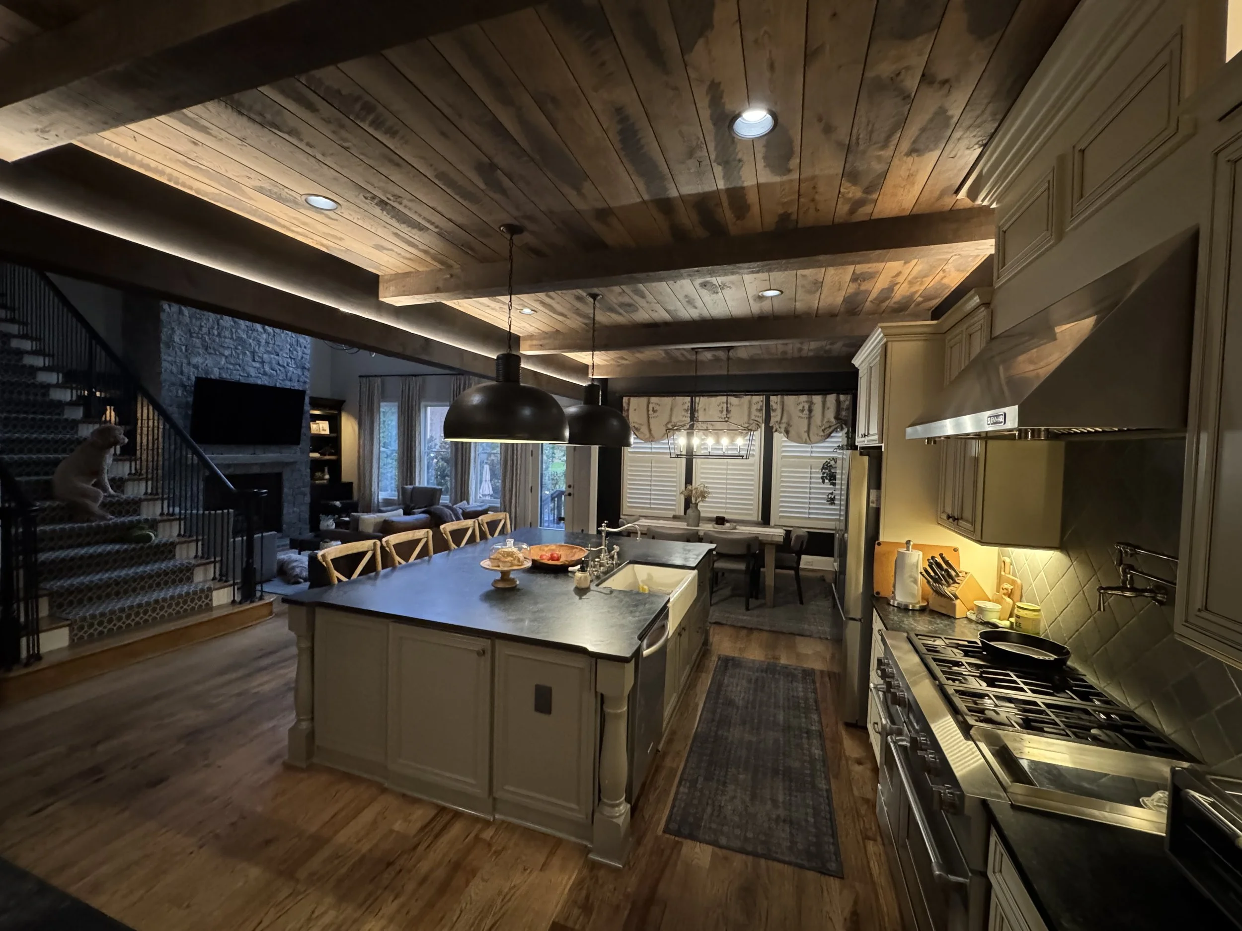 Kitchen with layered lighting design including pendant and accent lighting installed by Vigilant Voltage Electric