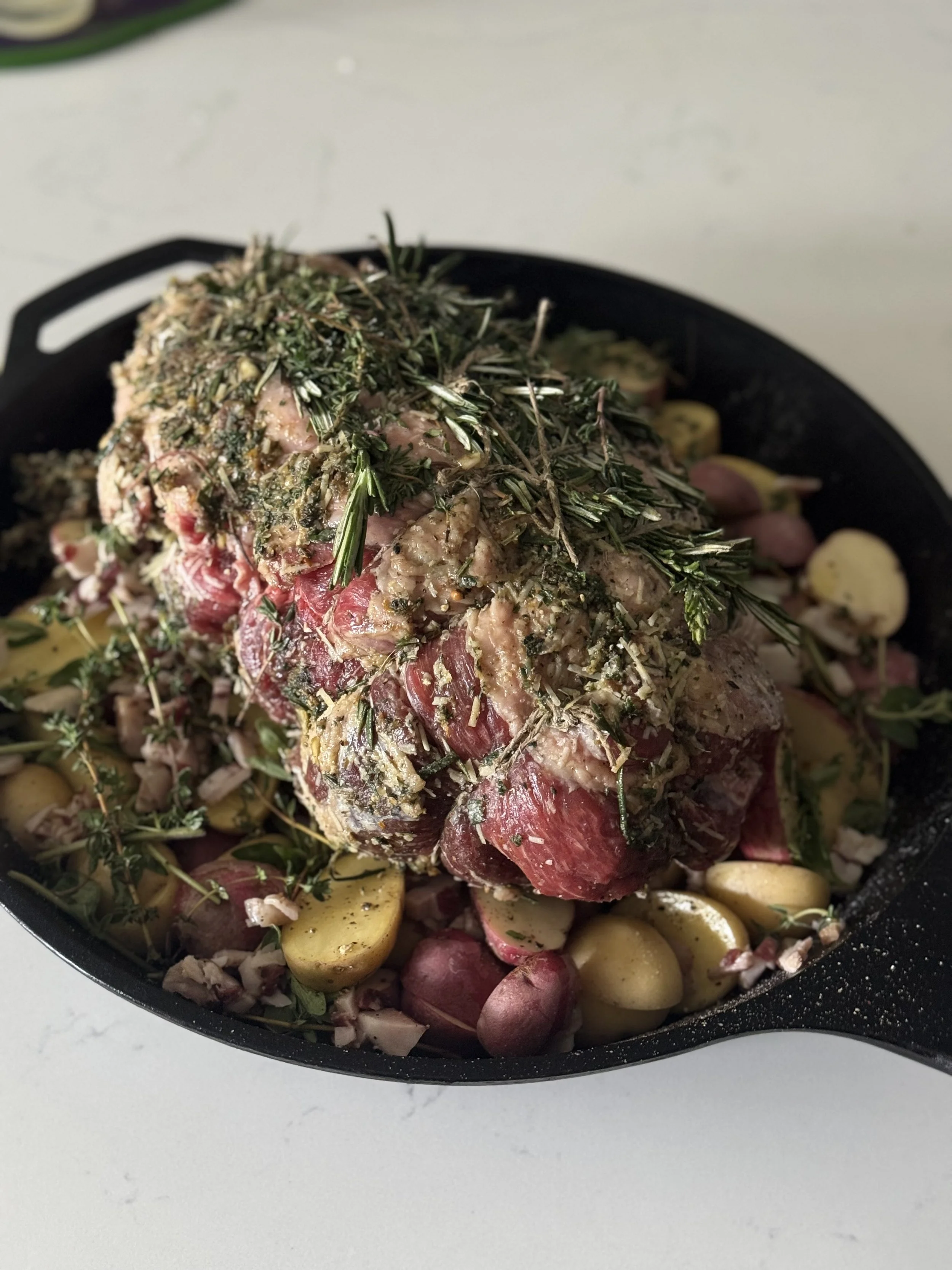 Boneless Leg of Lamb, rolled and covered in herbs and seasonings.