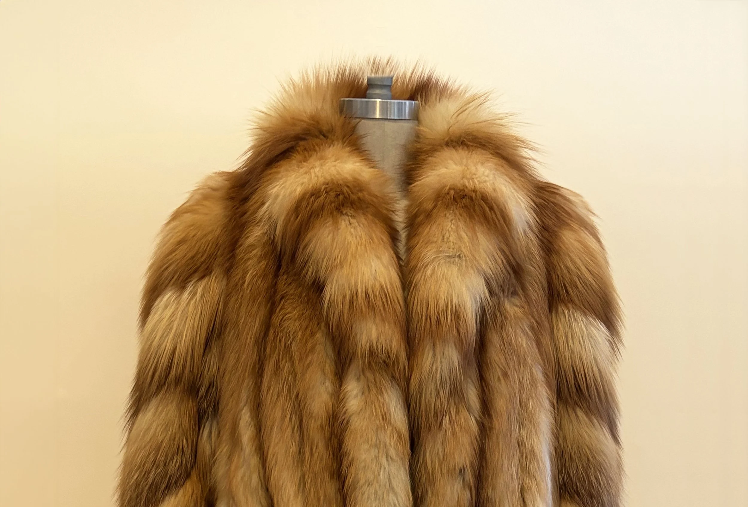 fur coat on stand